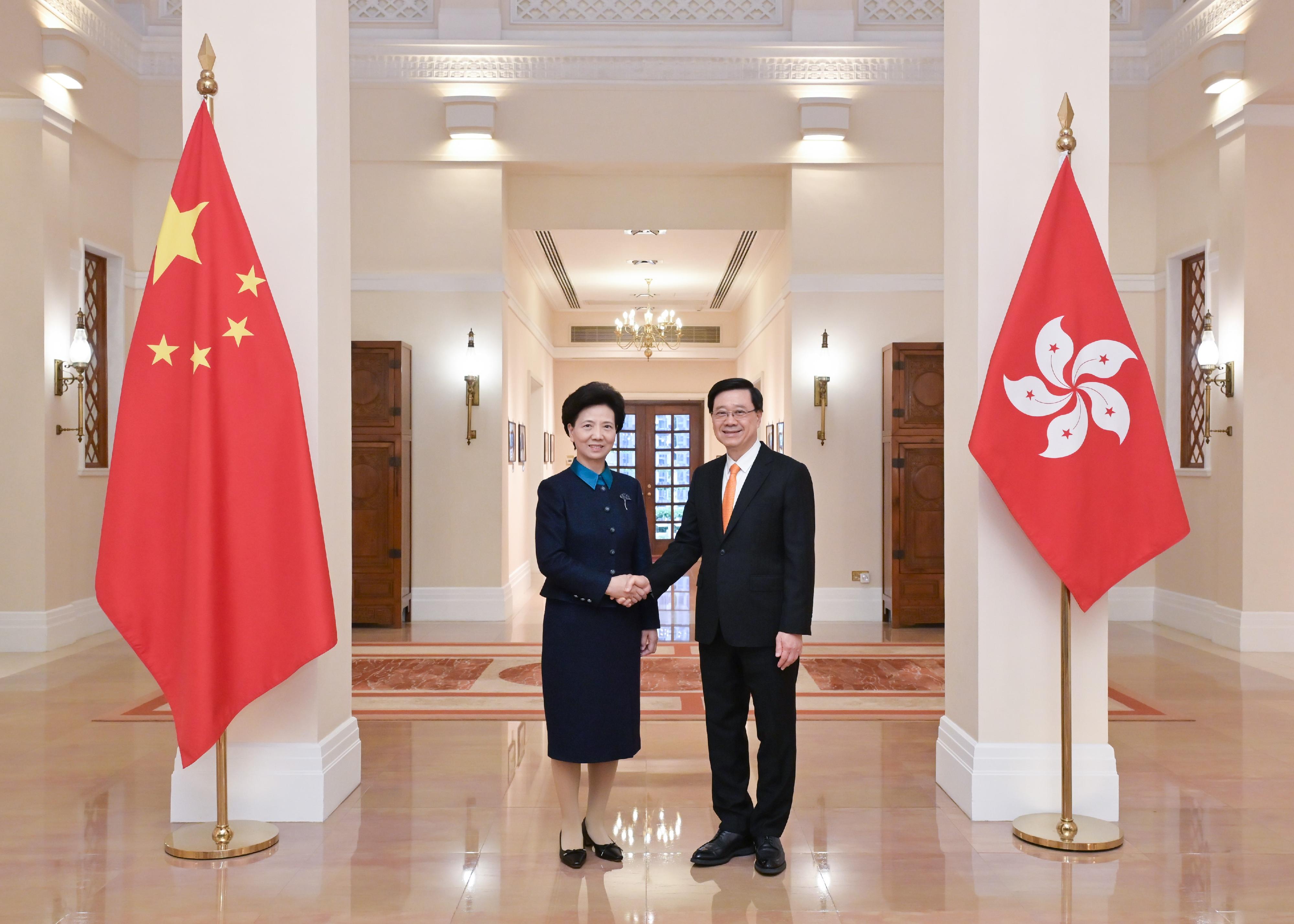 The Chief Executive, Mr John Lee (right), meets with State Councillor, Chairperson of the National Working Committee on Children and Women under the State Council and President of the All-China Women's Federation, Ms Shen Yiqin (left) at Government House today (March 31).