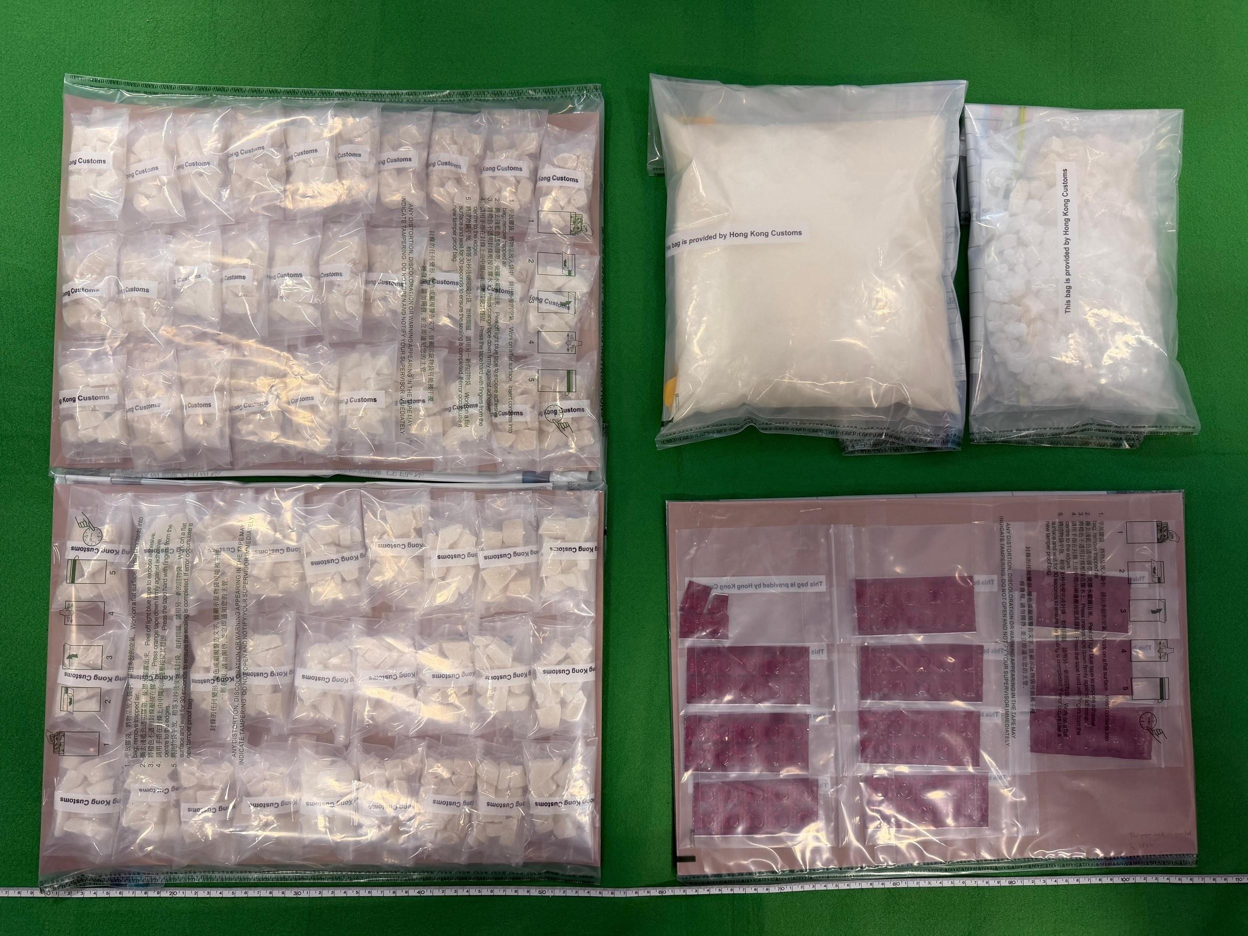Hong Kong Customs yesterday (March 30) seized about 2.4 kilograms of suspected ketamine, about 1.4kg of suspected crack cocaine and 104 tablets of suspected nimetazepam with a total estimated market value of about $2.6 million in Sham Tseng. A man and a woman suspected to be connected with the case were arrested. Photo shows the suspected drugs seized.
