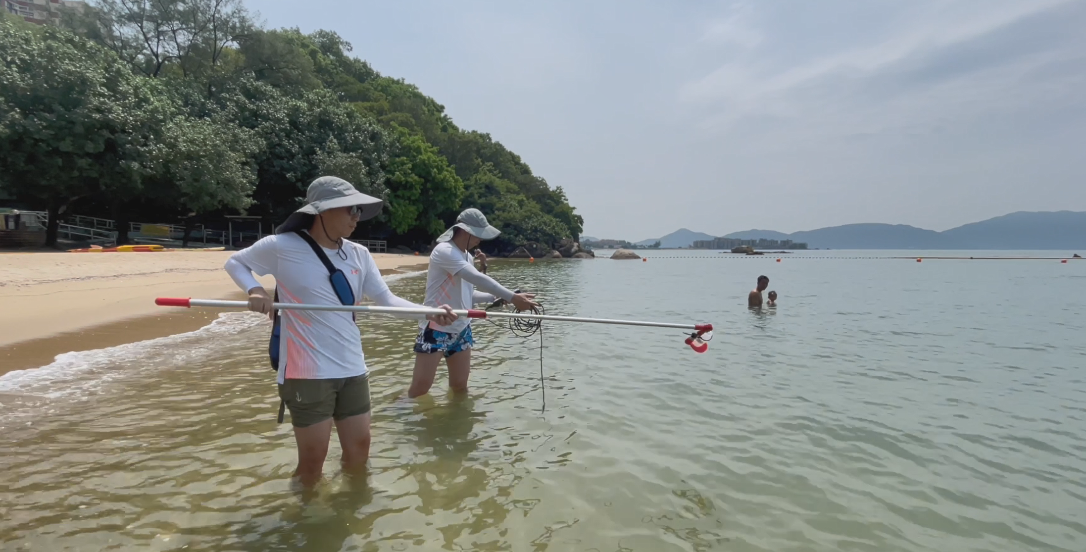 The 2025 Beach Water Quality Report shows that all gazetted beaches in Hong Kong have fully met the Water Quality Objective for 16 consecutive years.  Photo shows staff members of the Environmental Protection Department conducting beach water sampling.