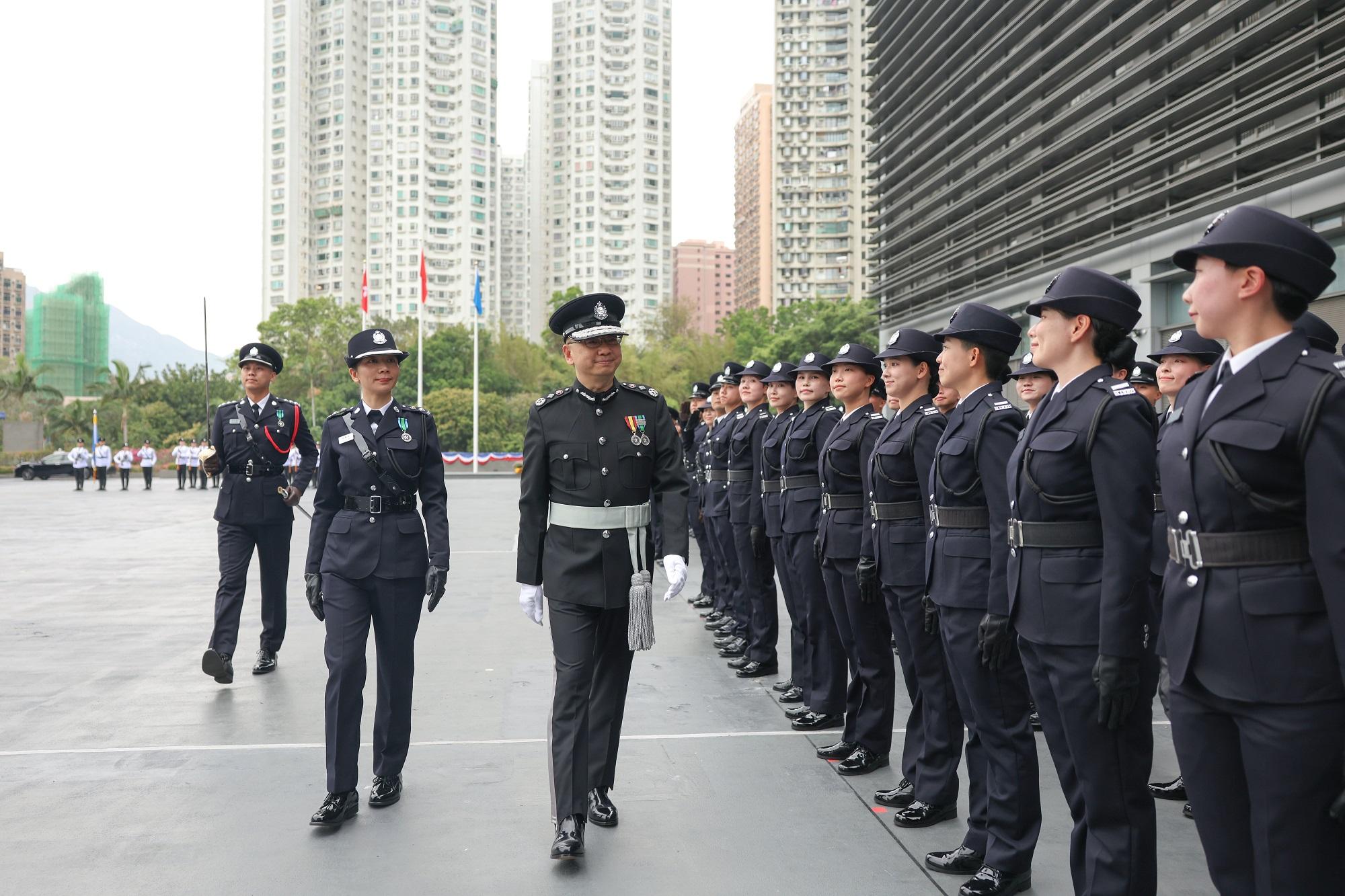 The Director of Immigration, Mr Benson Kwok (third left), inspects a contingent of graduates at the Immigration Service Institute of Training and Development Passing-out Parade today (April 1).