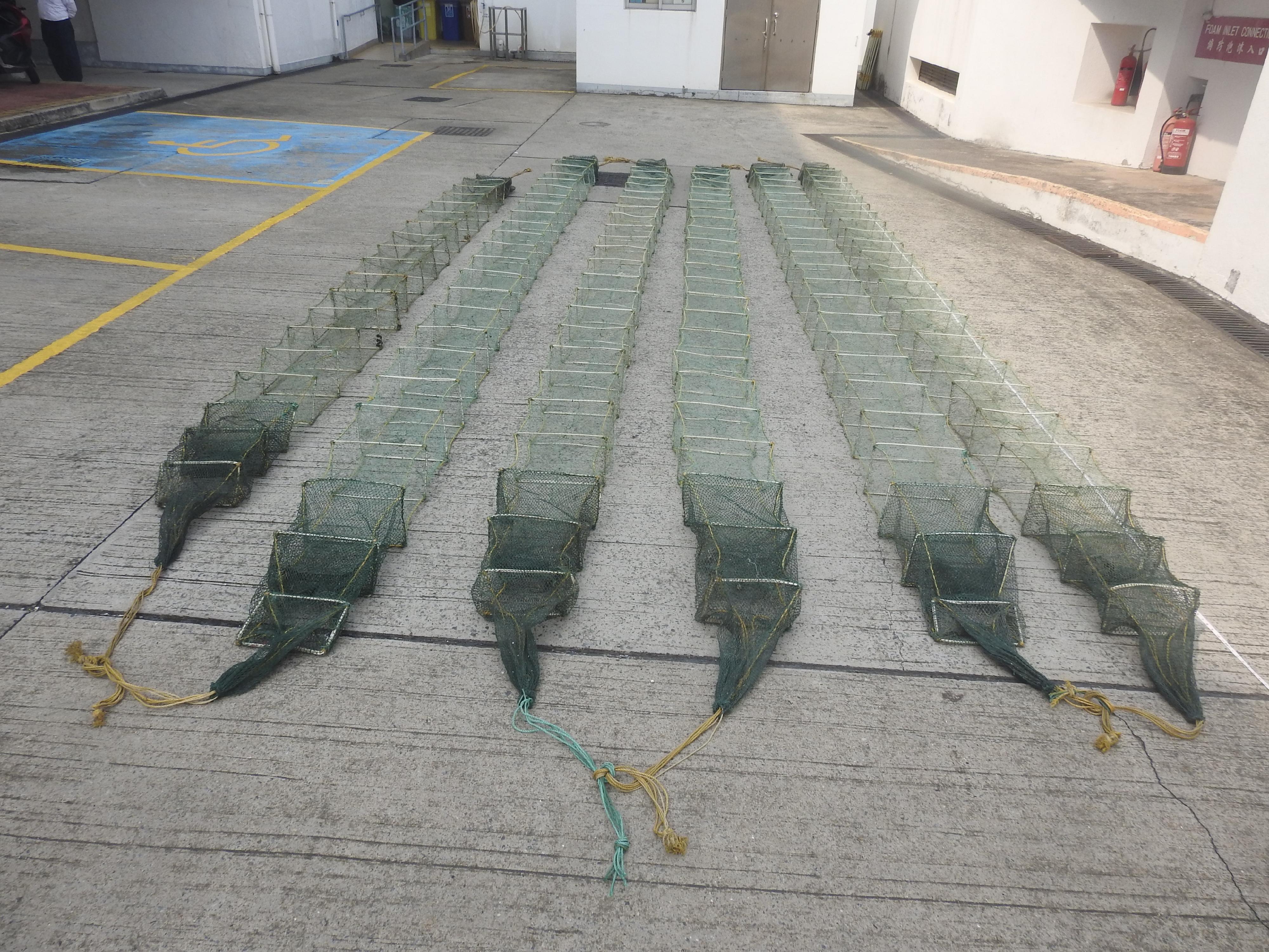 The Agriculture, Fisheries and Conservation Department today (April 8) laid charges against three Mainlanders suspected of engaging in fishing using snake cages on a Mainland vessel in waters off Tai A Chau. Photo shows some of the snake cages seized.