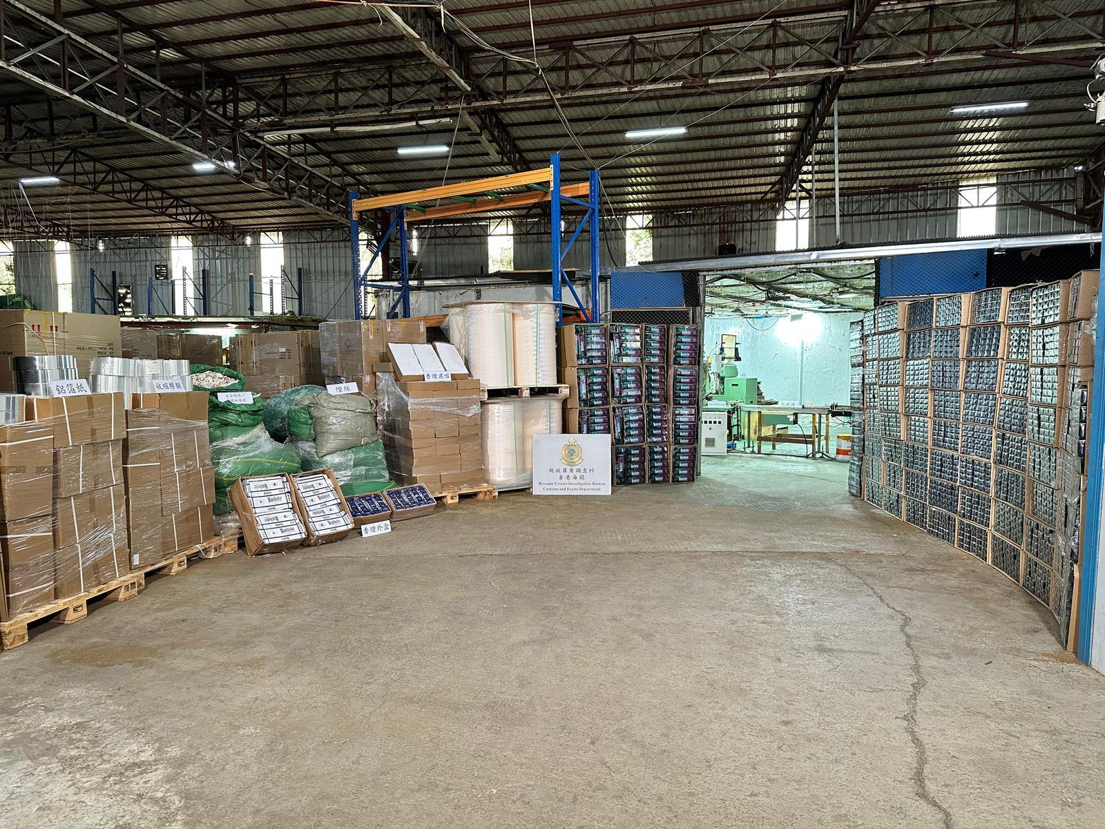 Hong Kong Customs shut down an underground cigarette factory in Fanling yesterday (April 9), and seized about 31.92 tons of suspected duty-not-paid manufactured tobacco and 1.23 million sticks of suspected illicit cigarette. The total estimated market value of all seizure was about $220 million, while the duty potential was about $130 million. Six person suspected to be connected with the case were arrested. Photo shows the raw materials used for manufacturing illicit cigarettes and finished illicit cigarette products seized in the metal hut.