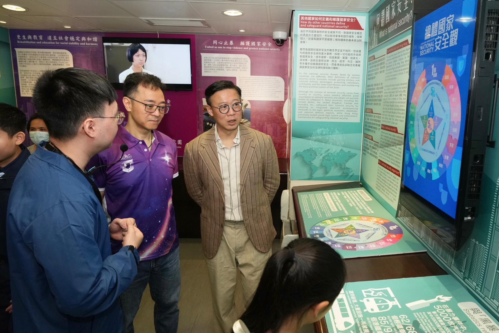 To support the 11th National Security Education Day on April 15 this year, the Correctional Services Department held an open day at the Hong Kong Correctional Services Museum and the Community Education Experience Centre today (April 11). Photo shows the Deputy Secretary for Justice, Dr Cheung Kwok-kwan (second right), accompanied by the Commissioner of Correctional Services, Mr Wong Kwok-hing (second left), visiting the national security exhibition gallery in the Hong Kong Correctional Services Museum.