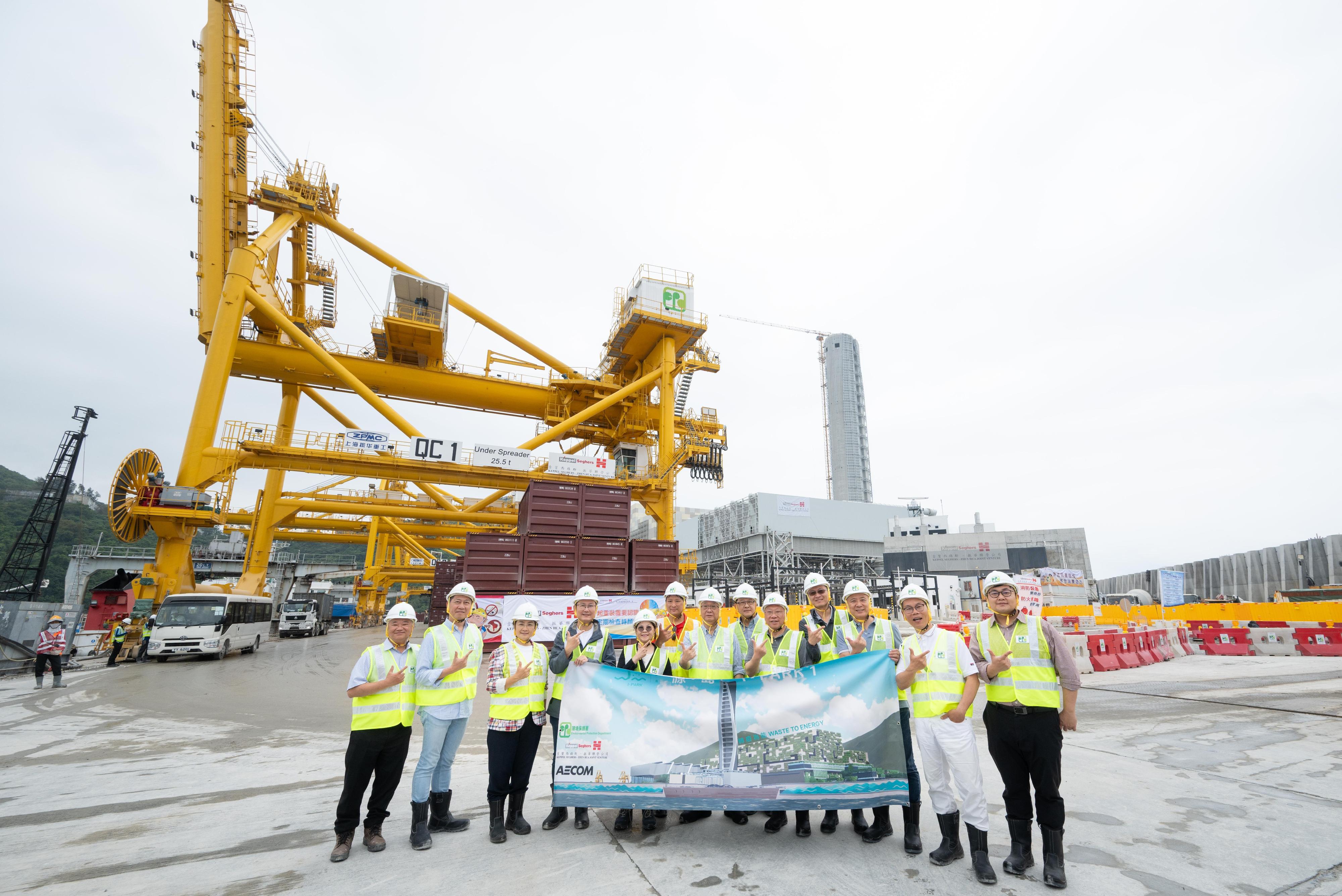 The Secretary for Environment and Ecology, Mr Tse Chin-wan (centre) ; the Permanent Secretary for Environment and Ecology (Environment), Mr Eddie Cheung (second left); the Under Secretary for Environment and Ecology, Miss Diane Wong (fifth left); the Director of Environmental Protection, Dr Samuel Chui (first left) and LegCo members today (April 11) inspected Hong Kong's first modern waste-to-energy facility located on an artificial island off Shek Kwu Chau for treating municipal solid waste - Integrated Waste Management Facilities Phase I (I·PARK1). Members were briefed on the latest progress of the trial operation of the facility.