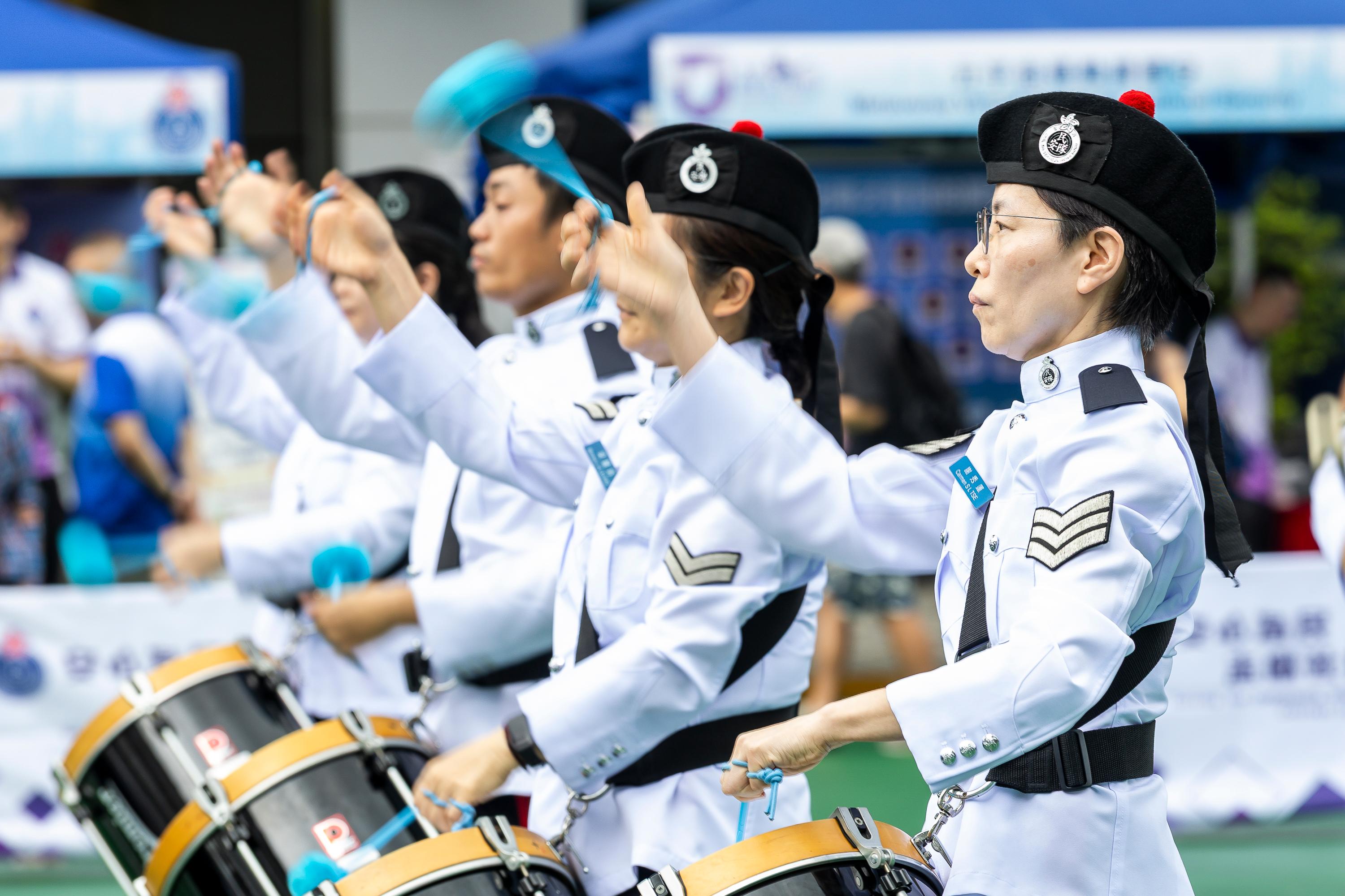 The Civil Aid Service (CAS) held an open day at its headquarters today (April 11) to promote National Security Education Day. Photo shows the CAS Band demonstrating distinctive Chinese military band music.