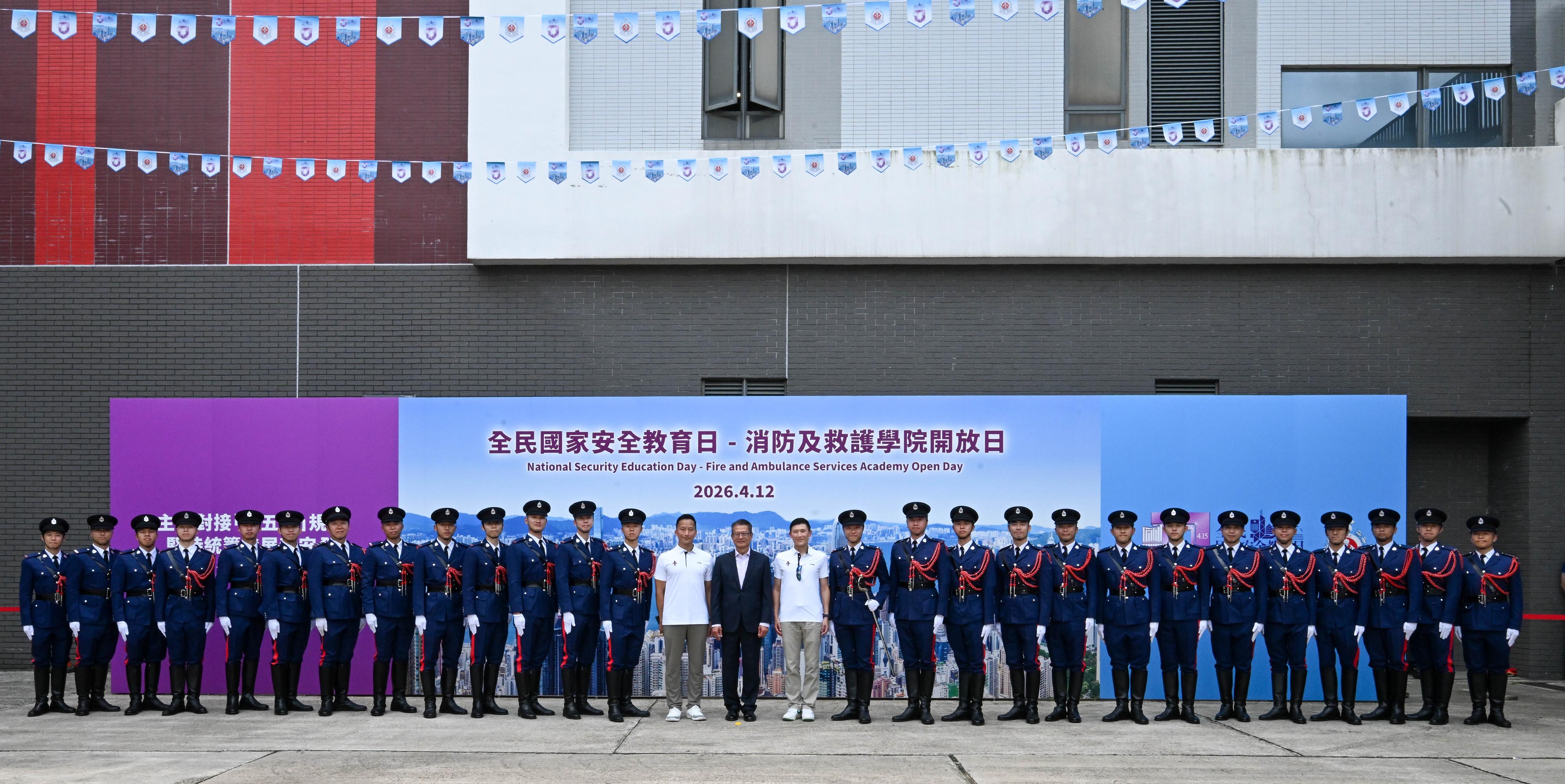 In response to and in support of the 11th National Security Education Day, the Fire Services Department (FSD) held an open day at the Fire and Ambulance Services Academy (FASA) in Tseung Kwan O today (April 12). Photo shows the Financial Secretary, Mr Paul Chan (centre); the Deputy Director of Fire Services (Operations), Mr Derek Armstrong Chan (fourteenth right); and the Commandant of the FASA, Mr Sunny Wong (fourteenth left), with the FSD's Guard of Honour.
