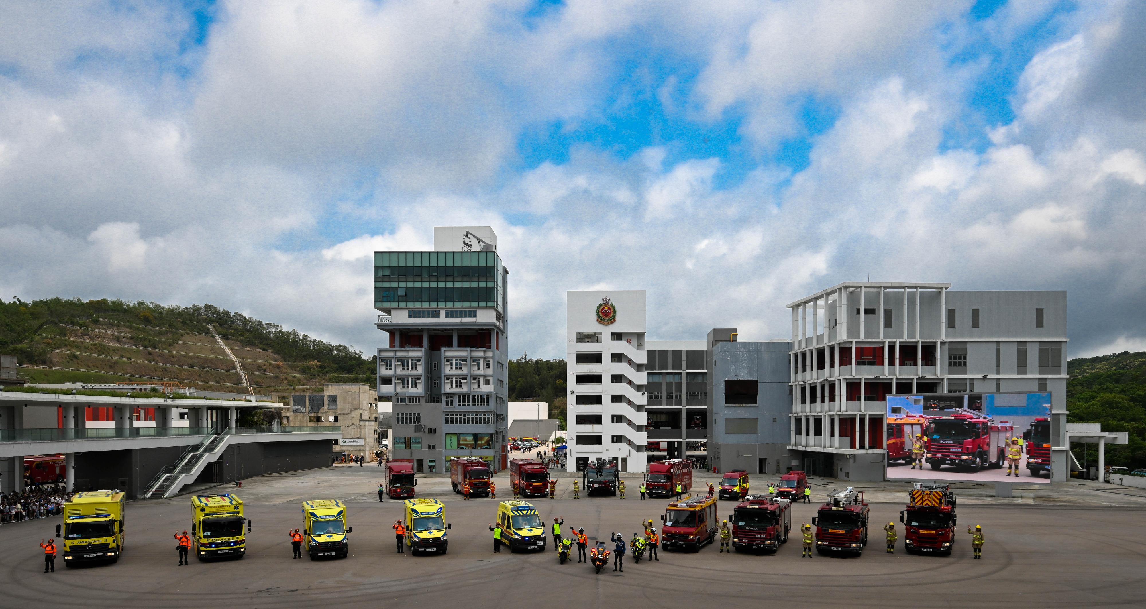 In response to and in support of the 11th National Security Education Day, the Fire Services Department held an open day at the Fire and Ambulance Services Academy in Tseung Kwan O today (April 12). Photo shows a fire and ambulance appliances parade.