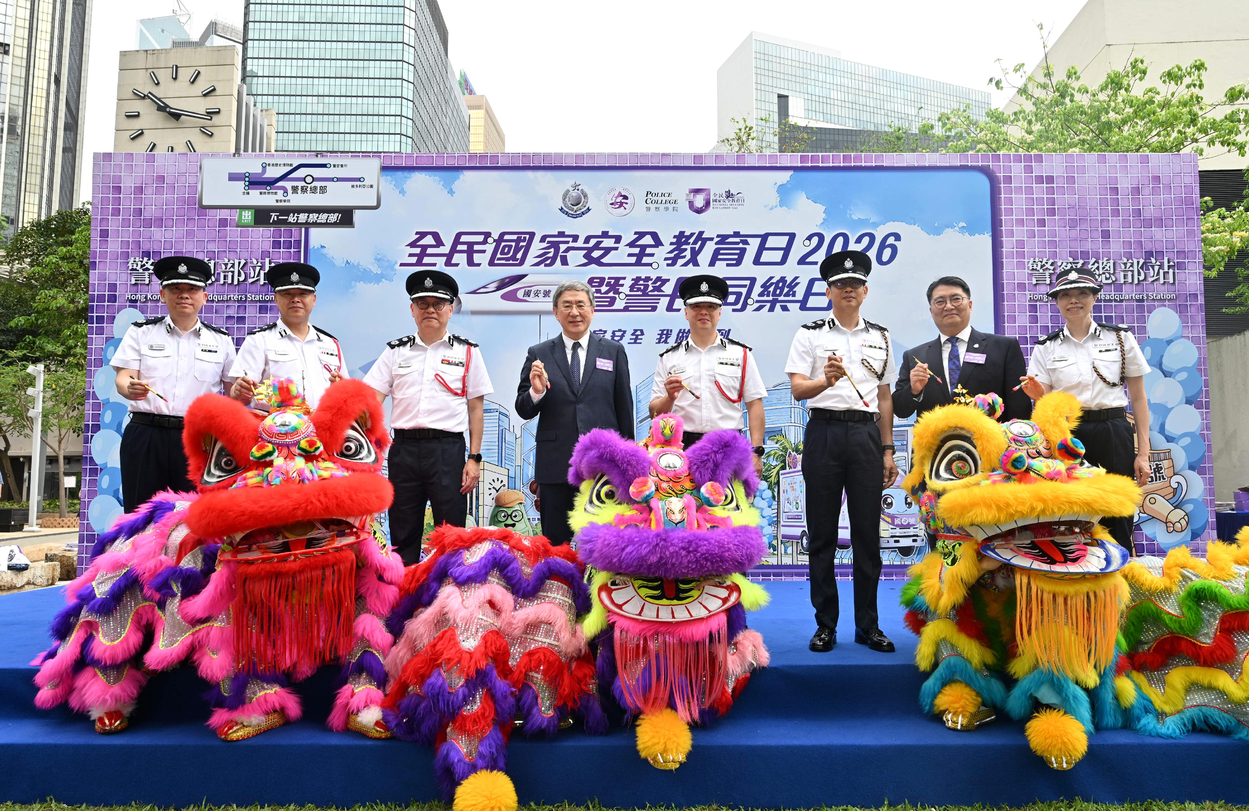The Hong Kong Police Force held the National Security Education Day 2026 cum Hong Kong Police Force Fun Day today (April 12). Photo shows the Deputy Chief Secretary for Administration, Mr Cheuk Wing-hing (fourth left); the Commissioner of Police, Mr Chow Yat-ming (fourth right); the Deputy Commissioner of Police (National Security), Mr Kan Kai-yan (third left); the Deputy Commissioner of Police (Management), Mr Chan Joon-sun (third right); the Director of Personnel and Training of Police, Mr Choi Chin-pang (second left); the Commandant of the Hong Kong Auxiliary Police Force, Mr Leung Sai-kwong (first left), and the Director of Hong Kong Police College, Ms Cheng Lai-ki (first right), officiating at the opening ceremony.
