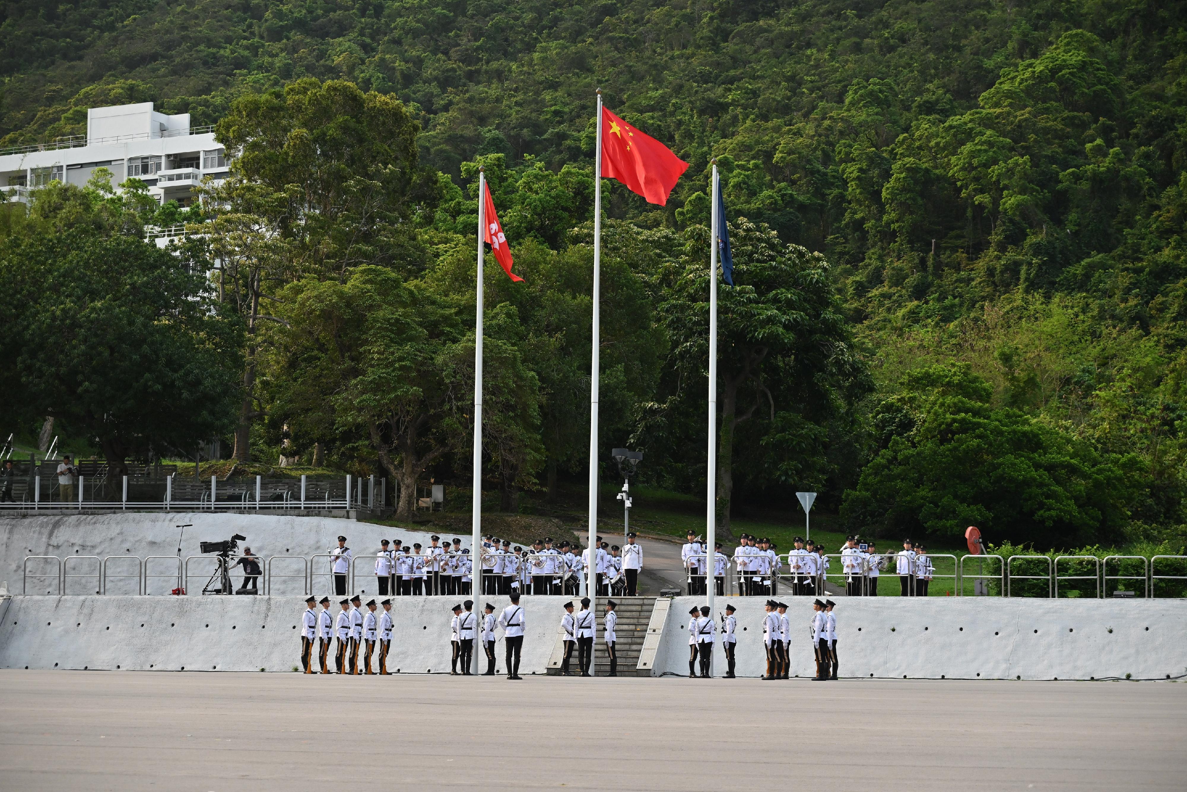保安局及轄下紀律部隊今日（四月十五日）在香港警察學院聯合舉行「全民國家安全教育日」升旗儀式。