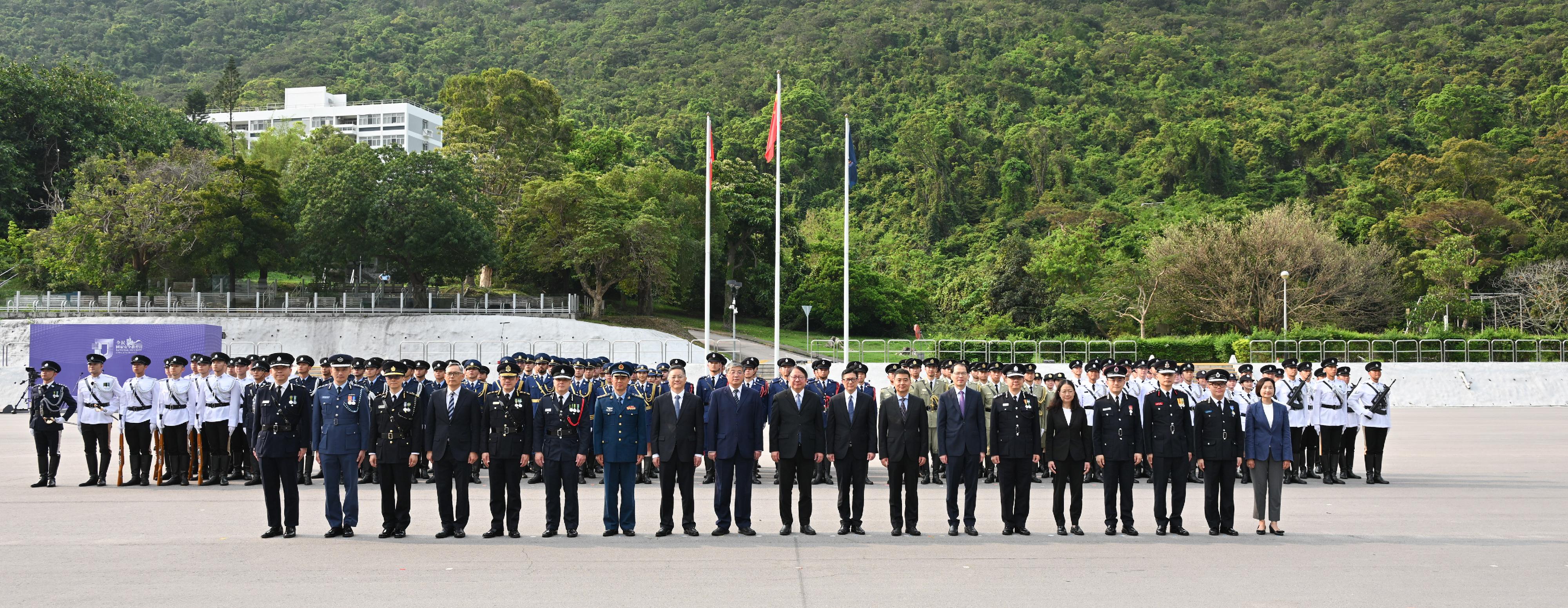 The Chief Secretary for Administration, Mr Chan Kwok-ki, attended the National Security Education Day flag-raising ceremony today (April 15). Photo shows Mr Chan (front row, tenth right); the Secretary for Security, Mr Tang Ping-keung (front row, ninth right); the Secretary General of the Committee for Safeguarding National Security of the Hong Kong Special Administrative Region, Mr Sonny Au (front row, seventh right); and heads of disciplined services departments and other officiating guests at the ceremony.