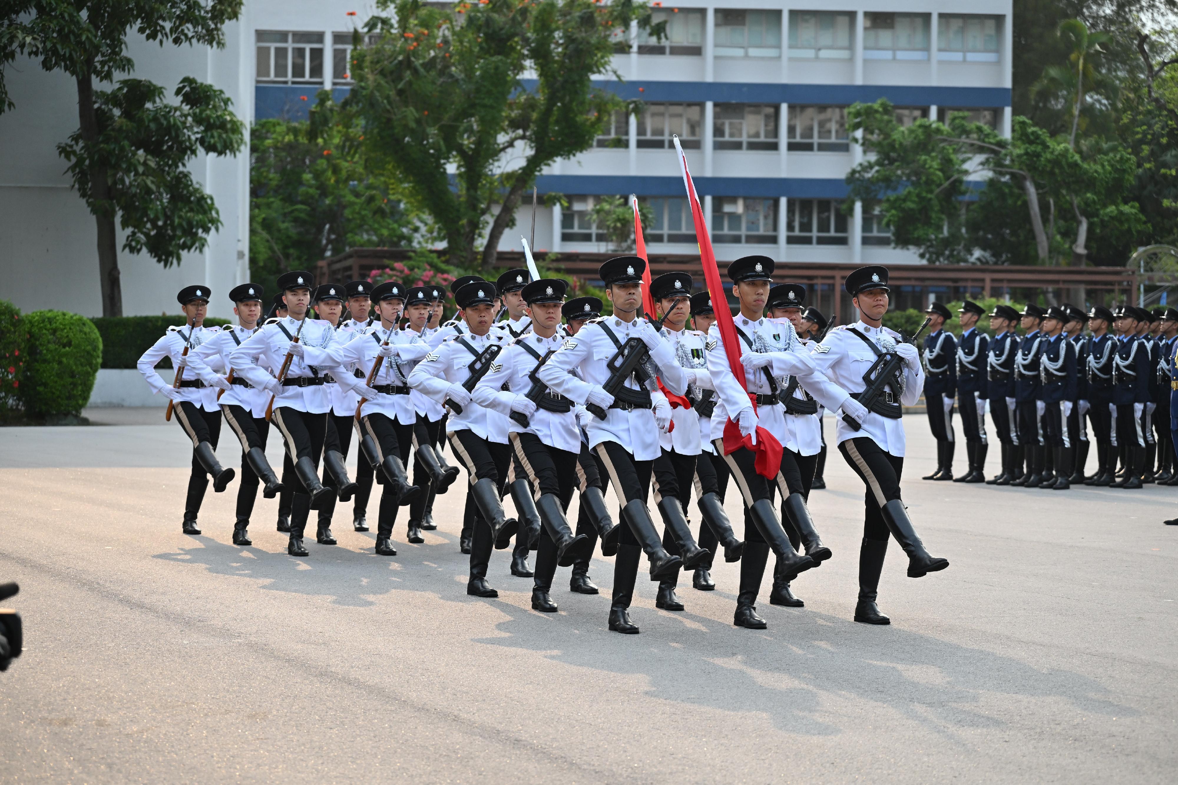 The Security Bureau and its disciplined services jointly held a National Security Education Day flag-raising ceremony at the Hong Kong Police College today (April 15). Photo shows a march-in by the Police flag party.
