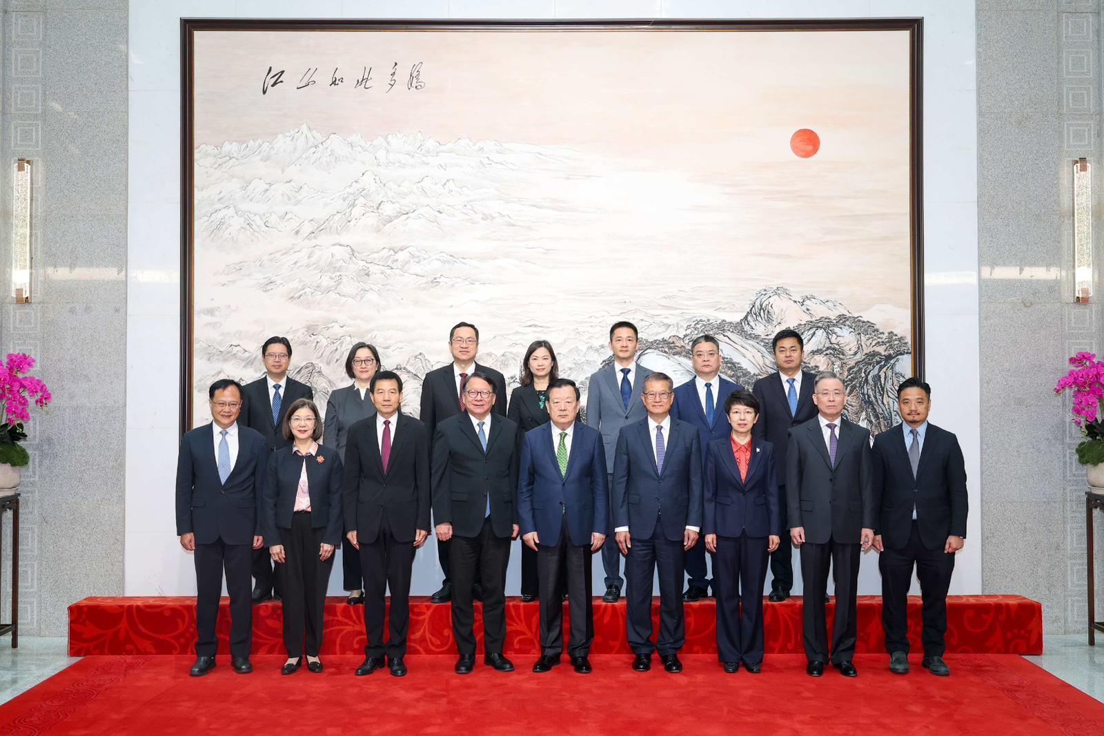 The Director of the Hong Kong and Macao Work Office of the Communist Party of China Central Committee and the Hong Kong and Macao Affairs Office of the State Council, Mr Xia Baolong (front row, centre) met with officials of the Hong Kong Special Administrative Region Government (HKSARG) this morning (April 16) to discuss and exchange on the work of Hong Kong to proactively align with the National 15th Five-Year Plan, and to better integrate into and serve the overall national development. The Executive Deputy Director of the Hong Kong and Macao Work Office of the Communist Party of China Central Committee and the Hong Kong and Macao Affairs Office of the State Council, Mr Xu Qifang (front row, third left) and Deputy Director Ms Zhang Dongmei (front row, third right) also joined the meeting.

HKSARG officials attending the meeting include the Chief Secretary for Administration, Mr Chan Kwok-ki (front row, fourth left); the Financial Secretary, Mr Paul Chan (front row, fourth right); the Secretary for Constitutional and Mainland Affairs, Miss Janice Tse Siu-wa (front row, second left); the Permanent Secretary for Constitutional and Mainland Affairs, Ms Maggie Wong (back row, fourth left); the Head of the Chief Executive's Policy Unit, Dr Stephen Wong (front row, first right); and the Commissioner for the Development of the Guangdong-Hong Kong-Macao Greater Bay Area, Miss Pamela Lam (back row, second left).
