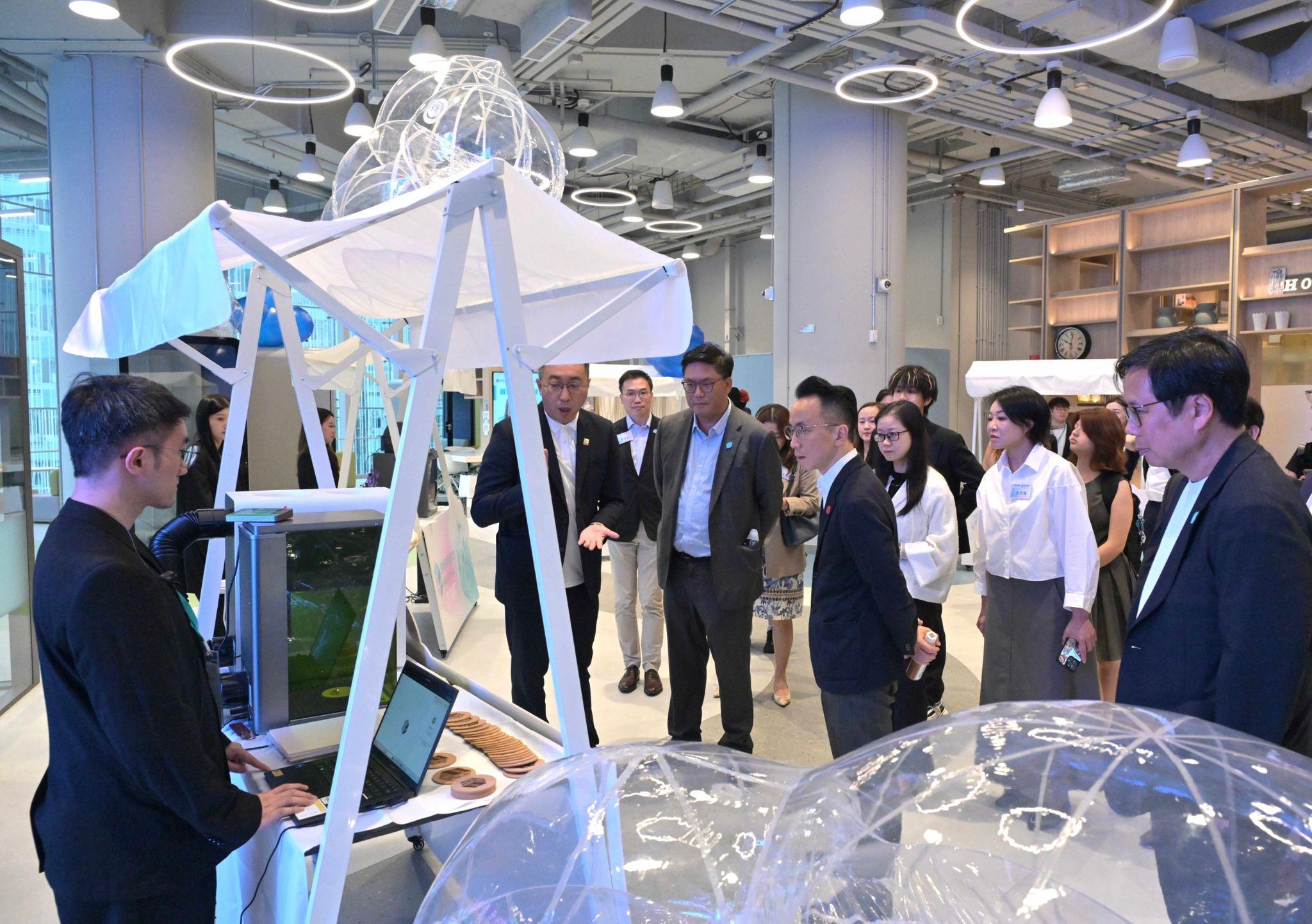 Supported by the Home and Youth Affairs Bureau (HYAB) and the Hong Kong Jockey Club Charities Trust, and operated by the Y.Elites Foundation Company Limited, the HYAB JC Y Cube, a new interactive space for young people, officially opened today (April 17). Photo shows the Permanent Secretary for Home and Youth Affairs, Mr Patrick Li (fourth left); the Under Secretary for Home and Youth Affairs, Mr Clarence Leung (third left); and the Commissioner for Youth, Mr Eric Chan (first right), accompanied by representative of the operator and Chairman of the Y.Elites Association, Mr Jason Wong (second left), touring the facilities of the Y Cube.