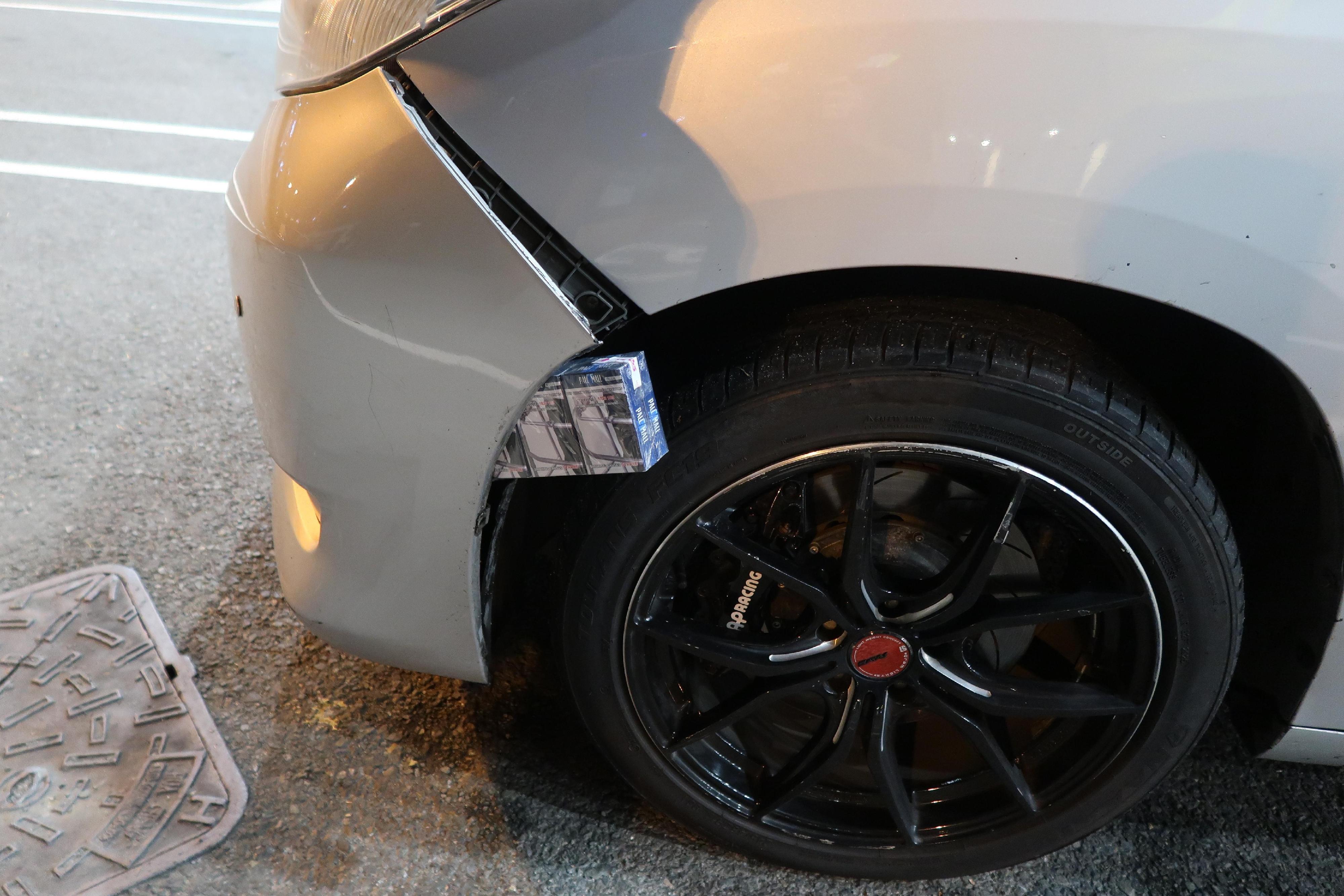 A 52-year-old man was sentenced to three months' imprisonment with a fine of $1,000 by the Fanling Magistrates' Courts today (April 18) for importing duty-not-paid cigarettes using a cross-boundary private car, in contravention of the Dutiable Commodities Ordinance. Photo shows the duty-not-paid cigarettes concealed inside the front bumper of the private car.