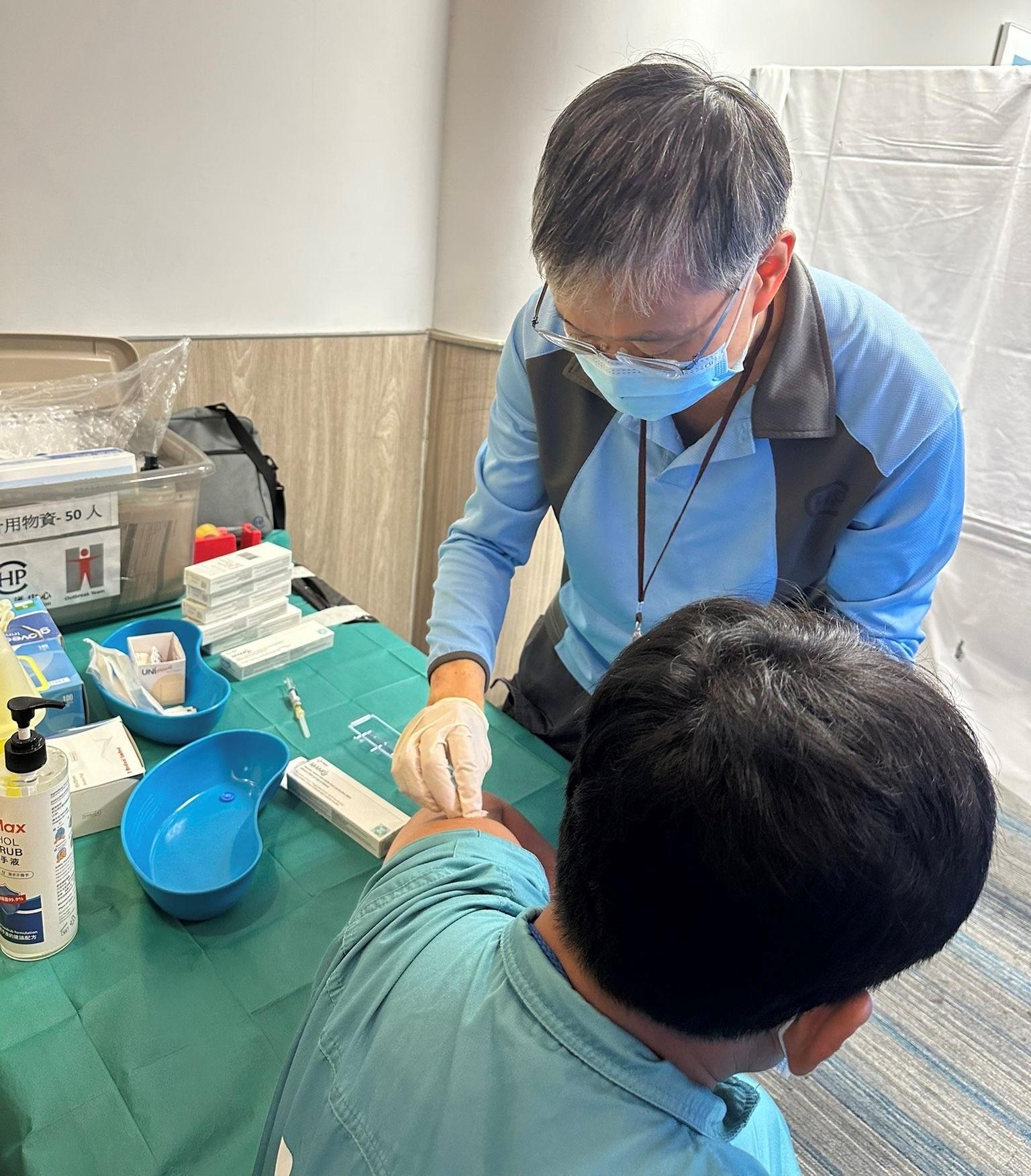 The Centre for Health Protection (CHP) of the Department of Health today (April 18) is investigating a local measles case epidemiological linked to earlier measles case. Photo shows a CHP staff conducting assessment and vaccination for a close contact working at the airport.