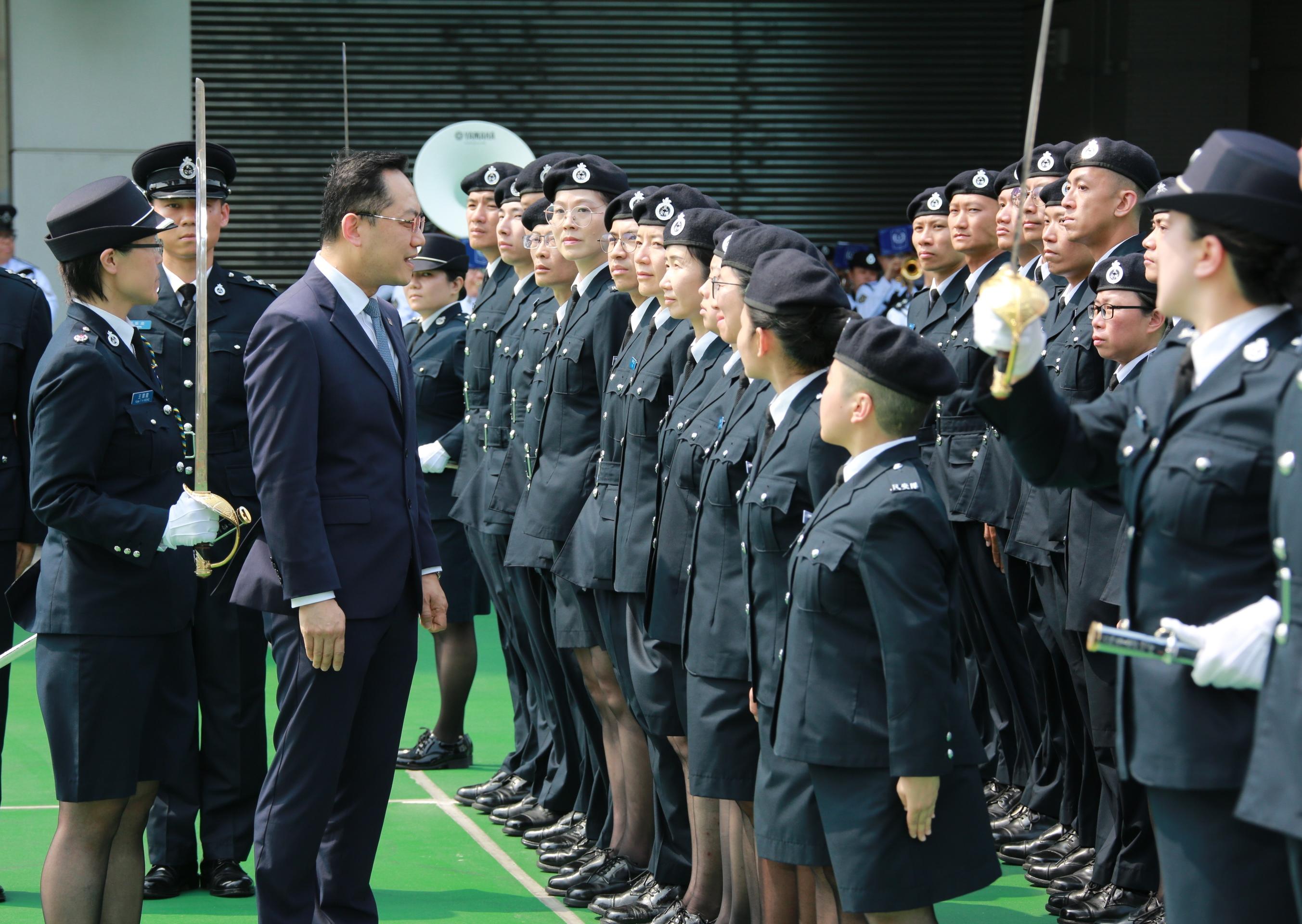 The Civil Aid Service held the Passing-out Parade for the 92nd Recruits and 14th Tactical Force Secondment Scheme at its headquarters today (April 19). Photo shows the Director of Health, Dr Ronald Lam (second left), inspecting the parade.
