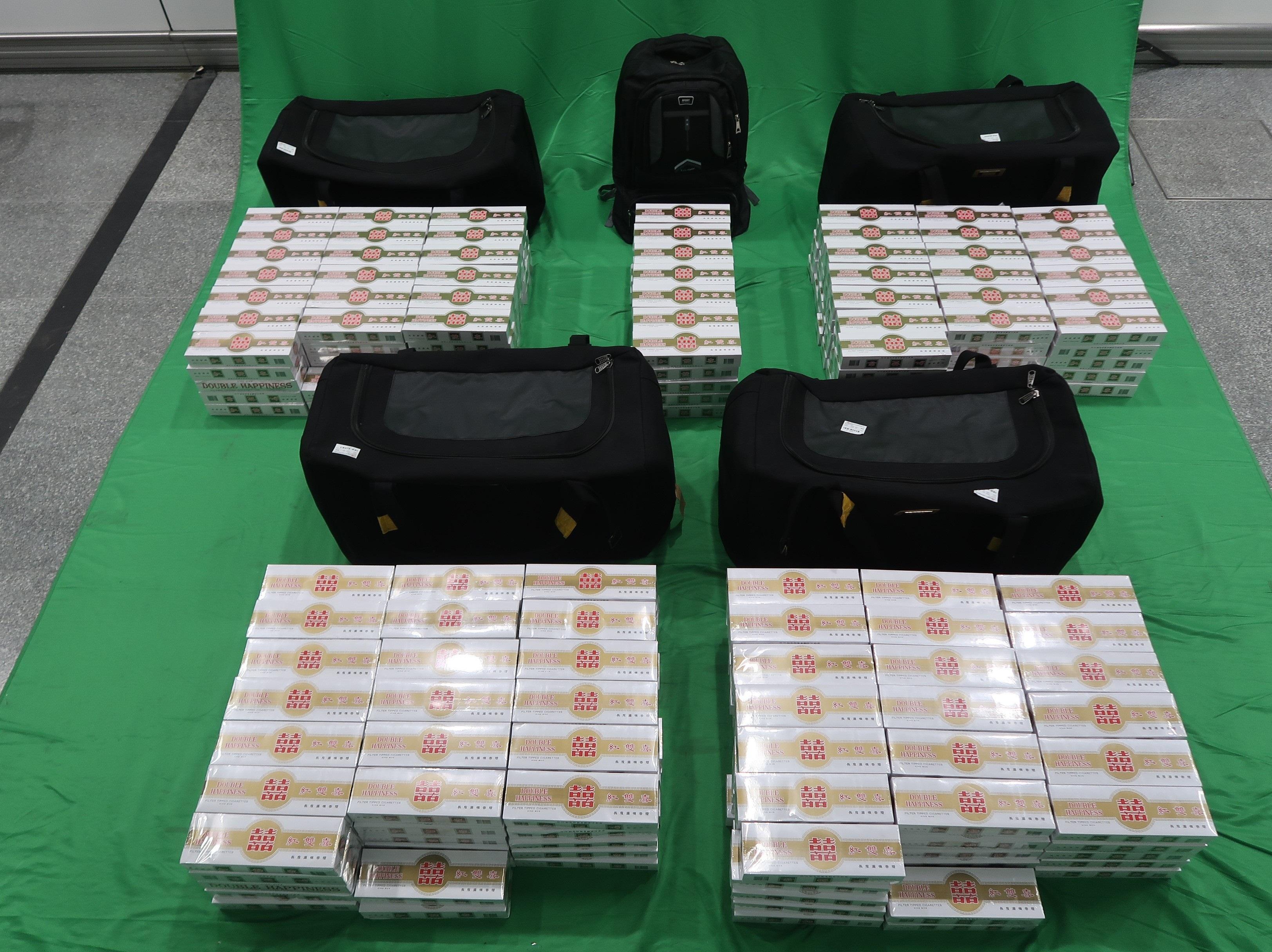 An incoming male passenger was sentenced to eight months' imprisonment and fined $1,000 by the West Kowloon Magistrates' Courts today (April 21) for importing duty-not-paid cigarettes and failing to declare them to Customs officers, in contravention of the Dutiable Commodities Ordinance. Photo shows the duty-not-paid cigarettes seized. 