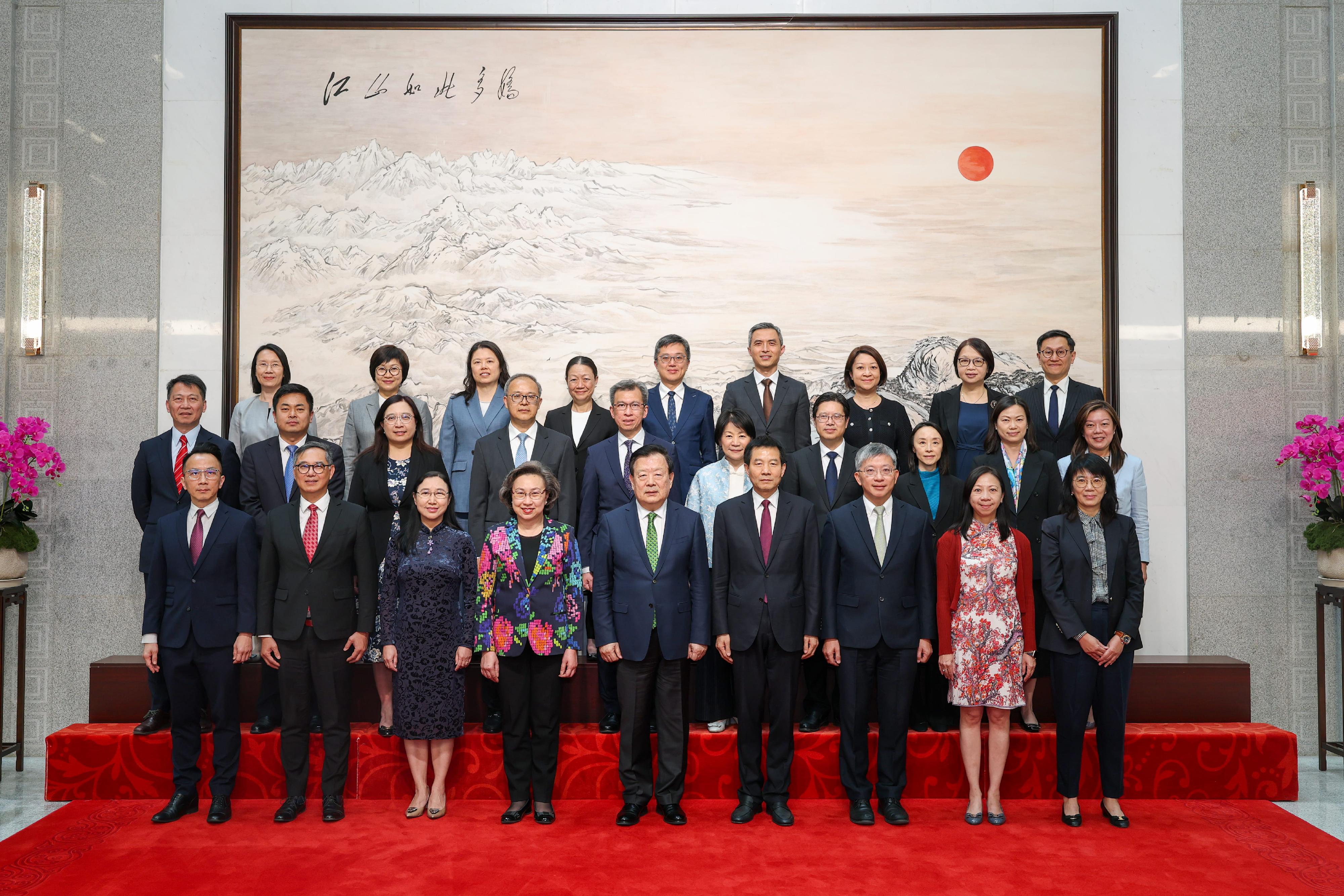 The Director of the Hong Kong and Macao Work Office of the Communist Party of China (CPC) Central Committee and the Hong Kong and Macao Affairs Office (HKMAO) of the State Council, Mr Xia Baolong (front row, centre), as well as the Executive Deputy Director of the Hong Kong and Macao Work Office of the CPC Central Committee and the HKMAO of the State Council, Mr Xu Qifang (front row, fourth right), took a group photo with the delegation of Permanent Secretaries and Heads of Departments of the Hong Kong Special Administrative Region Government for a national affairs study led by the Secretary for the Civil Service, Mrs Ingrid Yeung (front row, fourth left), this afternoon (April 21).