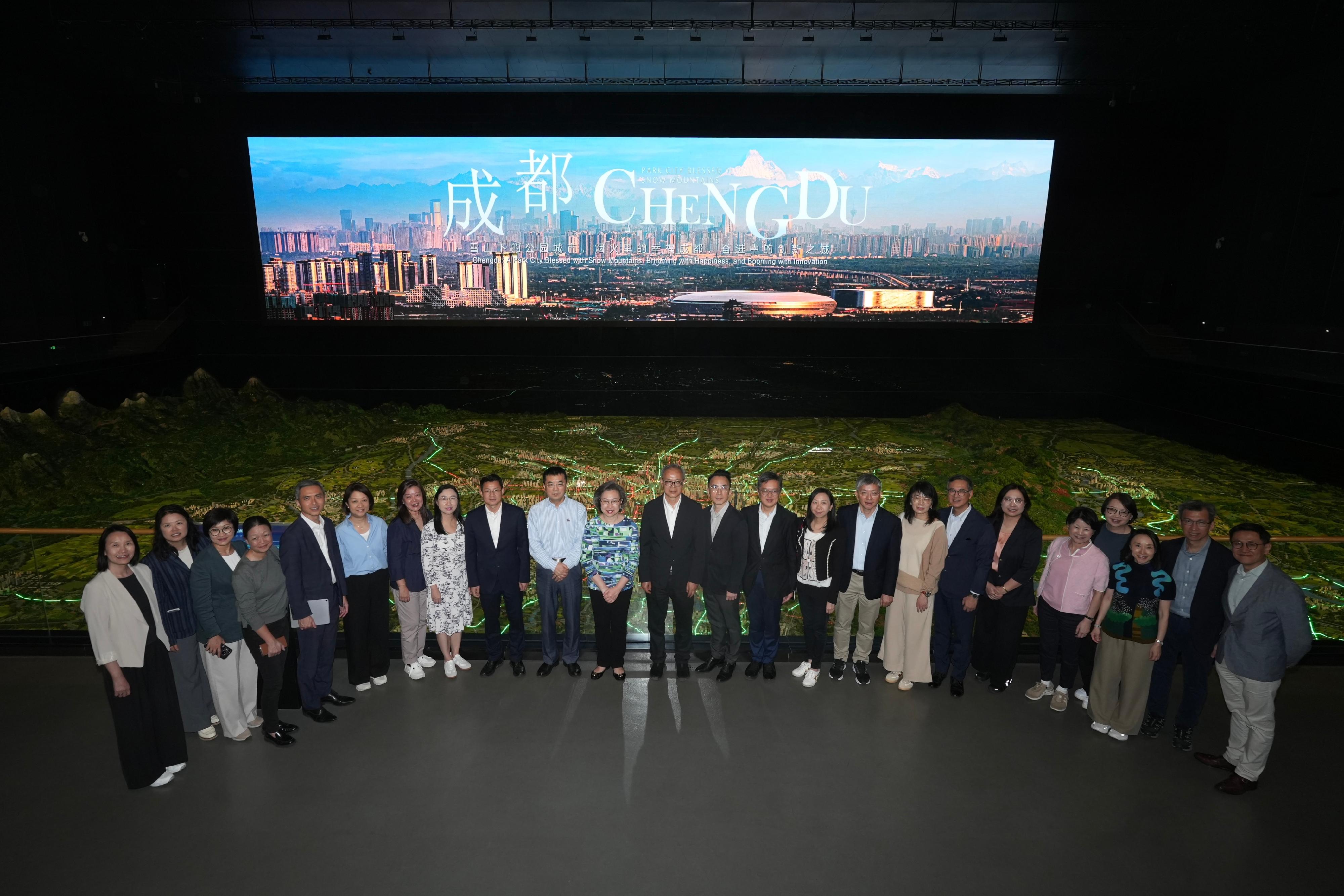 A delegation of Permanent Secretaries and Heads of Departments of the Hong Kong Special Administrative Region Government on a national affairs study led by the Secretary for the Civil Service, Mrs Ingrid Yeung (eleventh left), visited Chengdu Planning Exhibition Hall to learn more about the overall planning of Chengdu this morning (April 23). Looking on is the Director of Bureau II of the Hong Kong and Macao Work Office of the Communist Party of China Central Committee and the Hong Kong and Macao Affairs Office of the State Council, Mr Chen Jiguang (twelfth left).