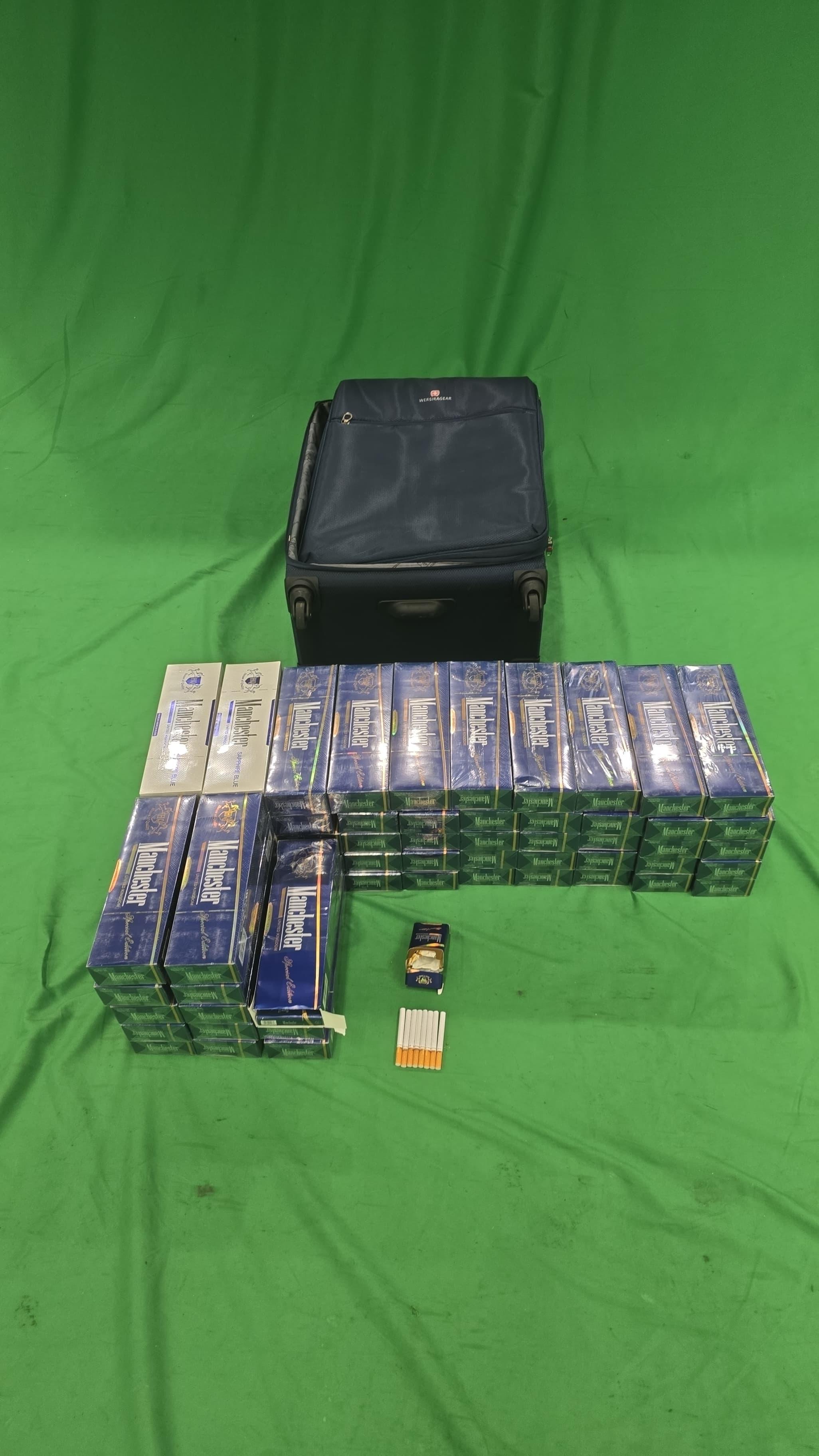 Three incoming passengers were sentenced to three to ten months' imprisonment and fined $1,000 each by the West Kowloon Magistrates' Courts today (April 23) for importing duty-not-paid cigarettes and failing to declare them to Customs officers, in contravention of the Dutiable Commodities Ordinance. Photo shows the duty-not-paid cigarettes seized in the third case.