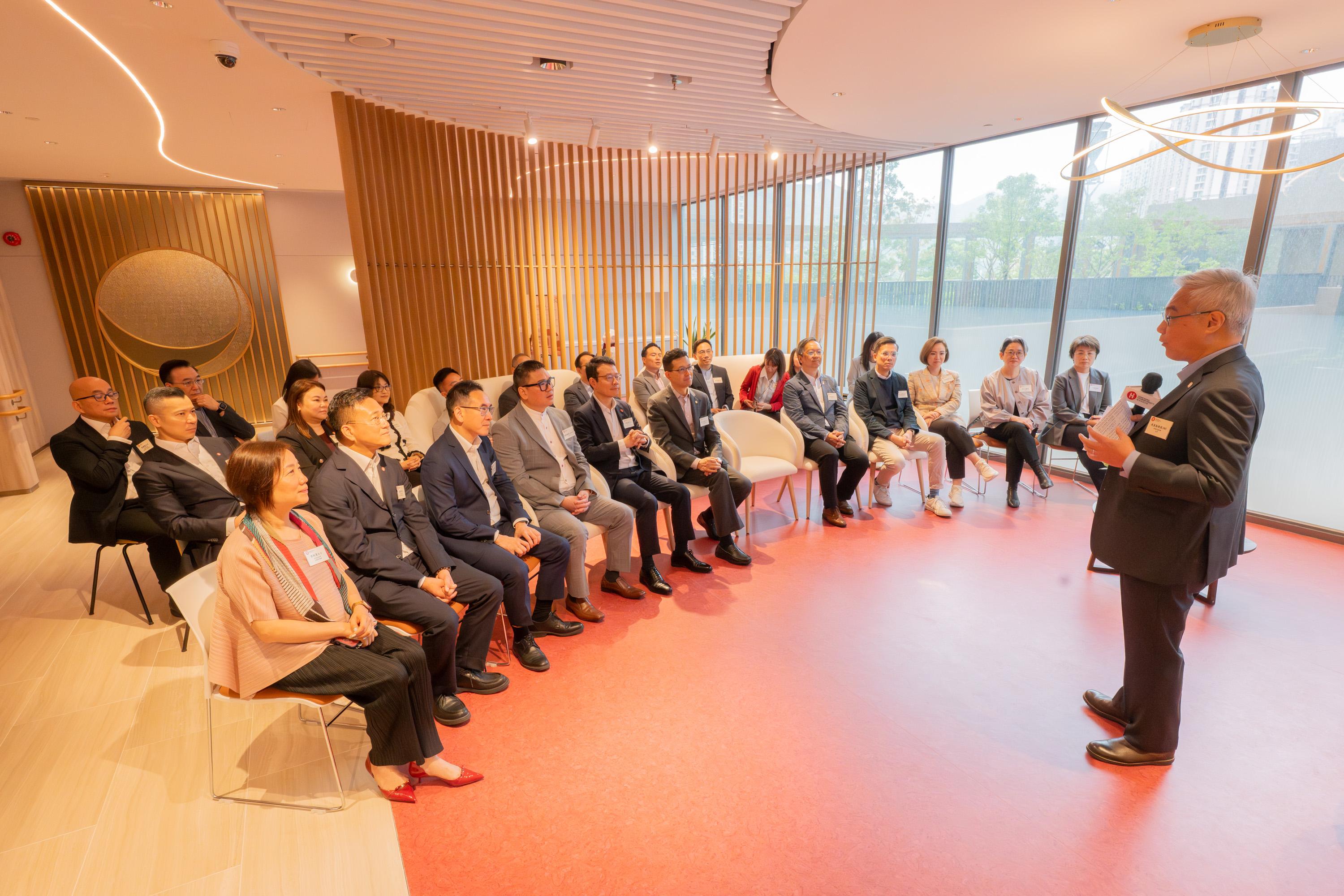 The Legislative Council Panel on Housing visited the Hong Kong Housing Society's (HKHS) Dedicated Rehousing Estate Casa Sierra in Fanling today (April 24). Photo shows Members receiving a briefing from the HKHS Chairman, Professor Ling Kar-kan, on the design and features of the estate.
