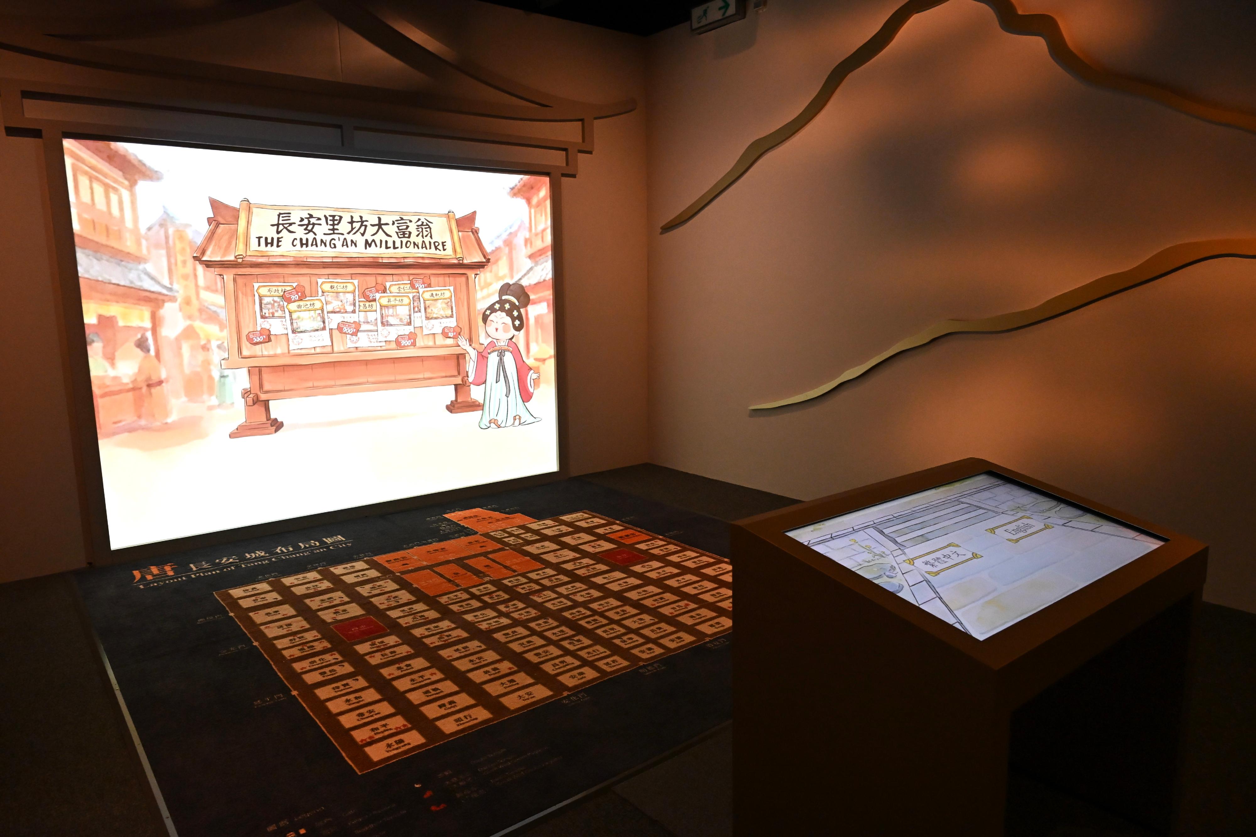 The Hong Kong Museum of History's "The Hong Kong Jockey Club Series: Prosperity and Magnificence - Civilisation of the Sui and Tang Dynasties in Shaanxi Province" exhibition will be open to the public from tomorrow (April 25). Photo shows a multimedia interactive game "The Chang'an Millionaire" where visitors can learn about the large-scale and well-organised city planning of Tang Chang'an City. 
