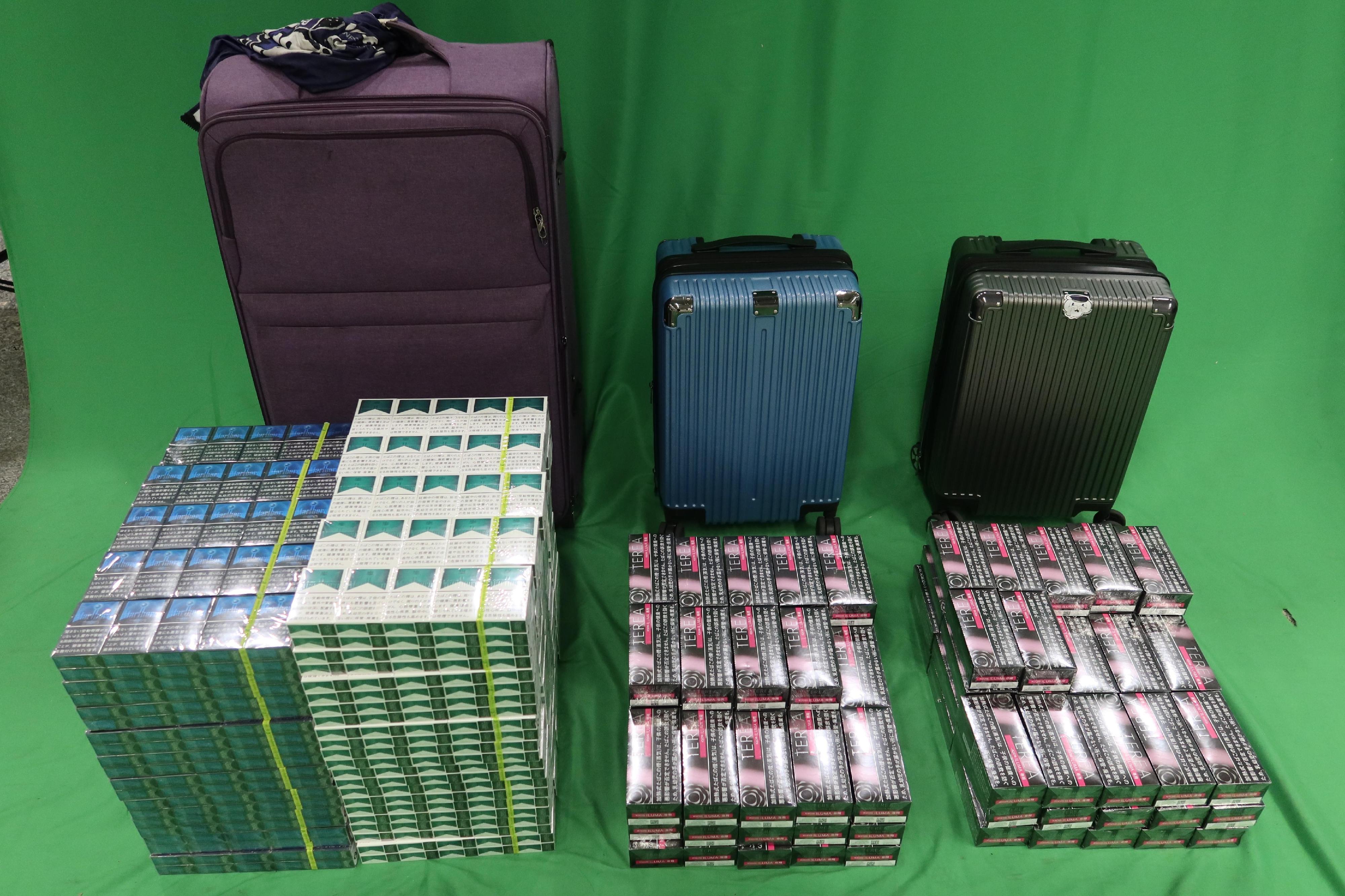 An incoming male passenger was sentenced to four months' imprisonment by the West Kowloon Magistrates' Courts today (April 25) for importing duty-not-paid cigarettes and failing to declare them to Customs officers, as well as importing alternative smoking products, in contravention of the Dutiable Commodities Ordinance and the Import and Export Ordinance.  Photo shows the duty-not-paid cigarettes and the alternative smoking products seized in the case.