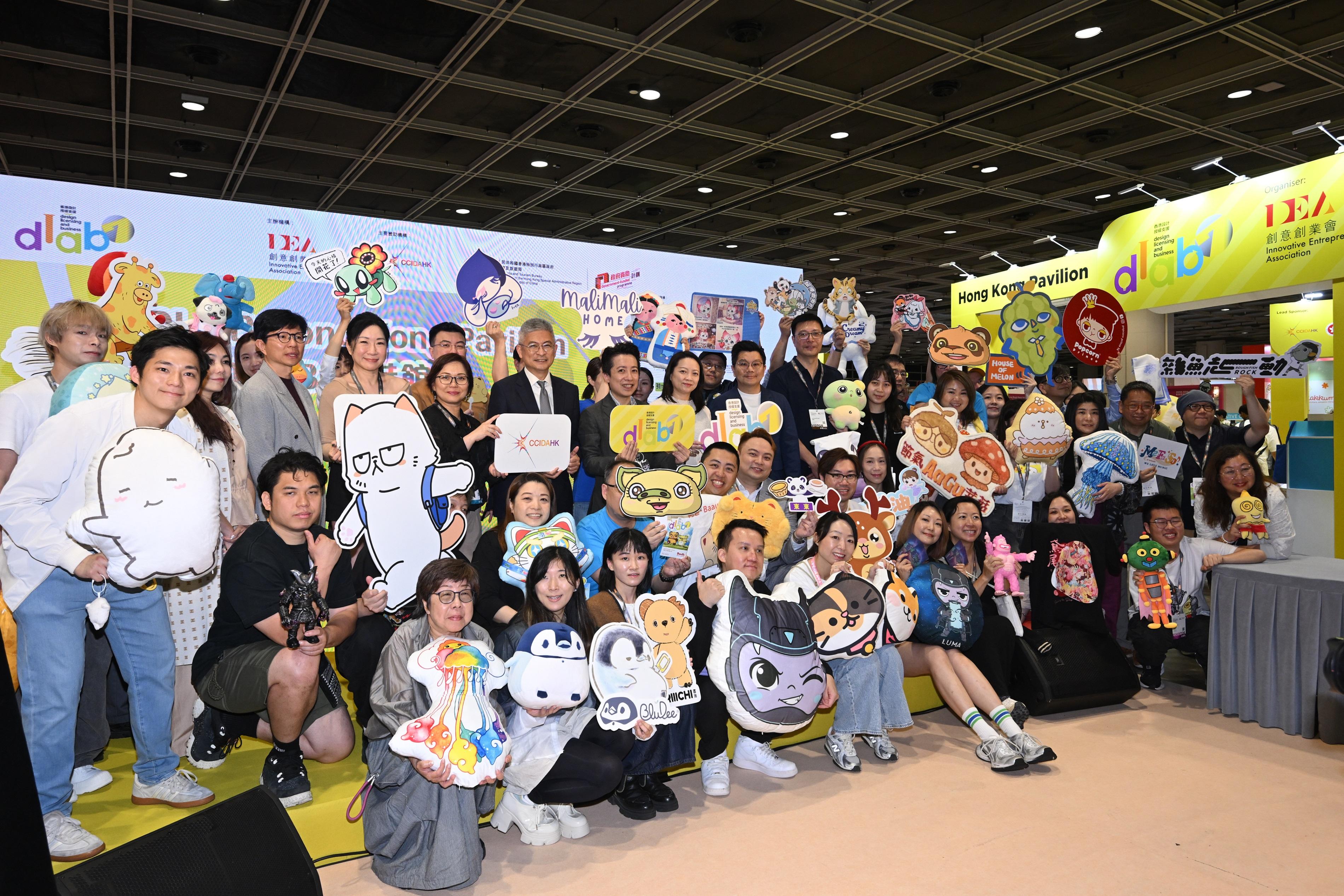 The Cultural and Creative Industries Development Agency under the Culture, Sports and Tourism Bureau sponsored the seventh Design Licensing and Business (DLAB) Support Scheme, organised by the Innovative Entrepreneur Association, to participate in the Hong Kong International Licensing Show 2026 and set up the DLAB Hong Kong Pavilion therein. Running for three days from today (April 27) to April 29, the Hong Kong Pavilion showcases original creations from 39 selected local design companies. Photo shows the Under Secretary for Culture, Sports and Tourism, Mr Raistlin Lau (sixth left, third row), and other guests attending the DLAB Hong Kong Pavilion Launching Ceremony.