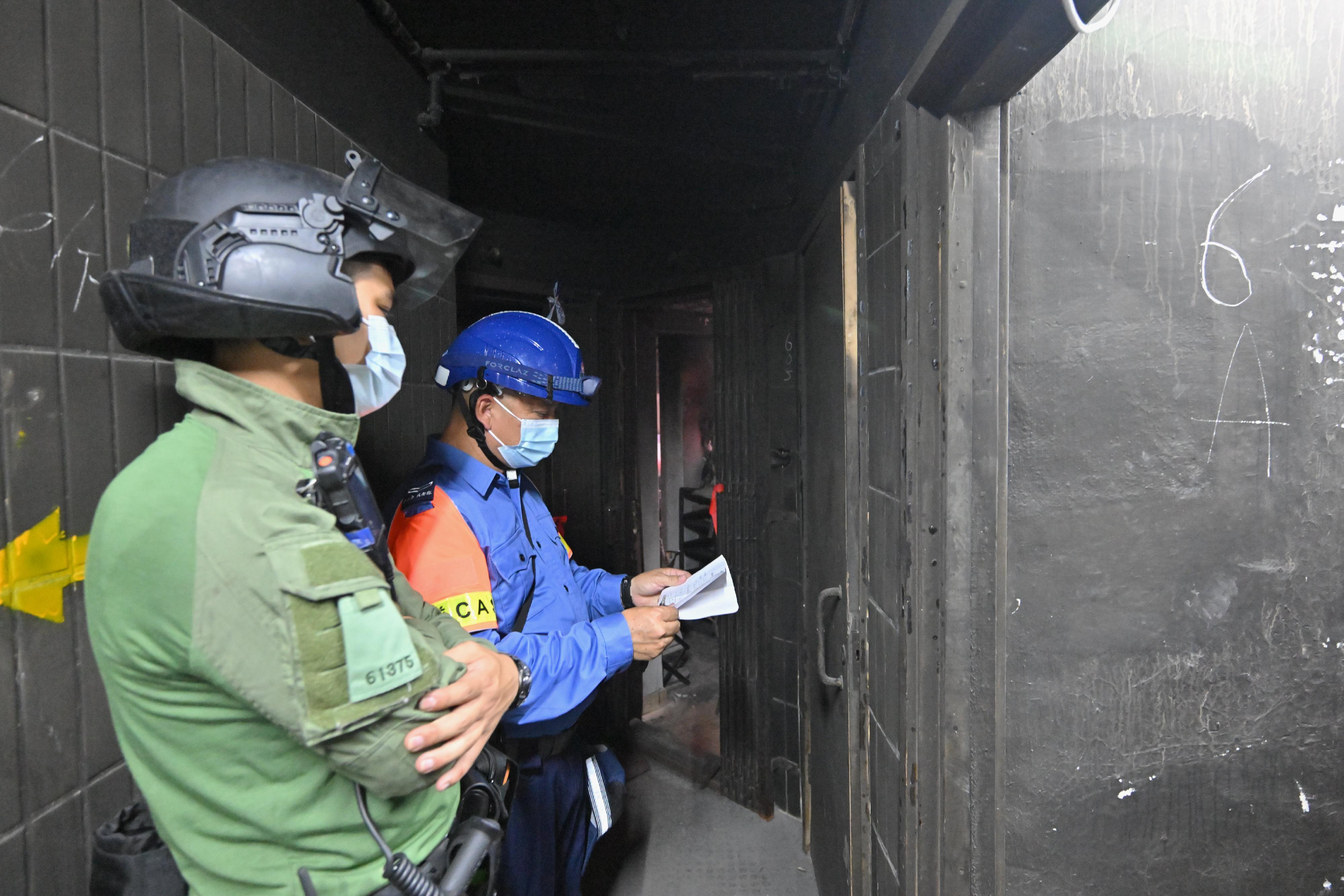 Police officers and members of the Civil Aid Service are stationed on different floors, offering full support to residents returning to their units.