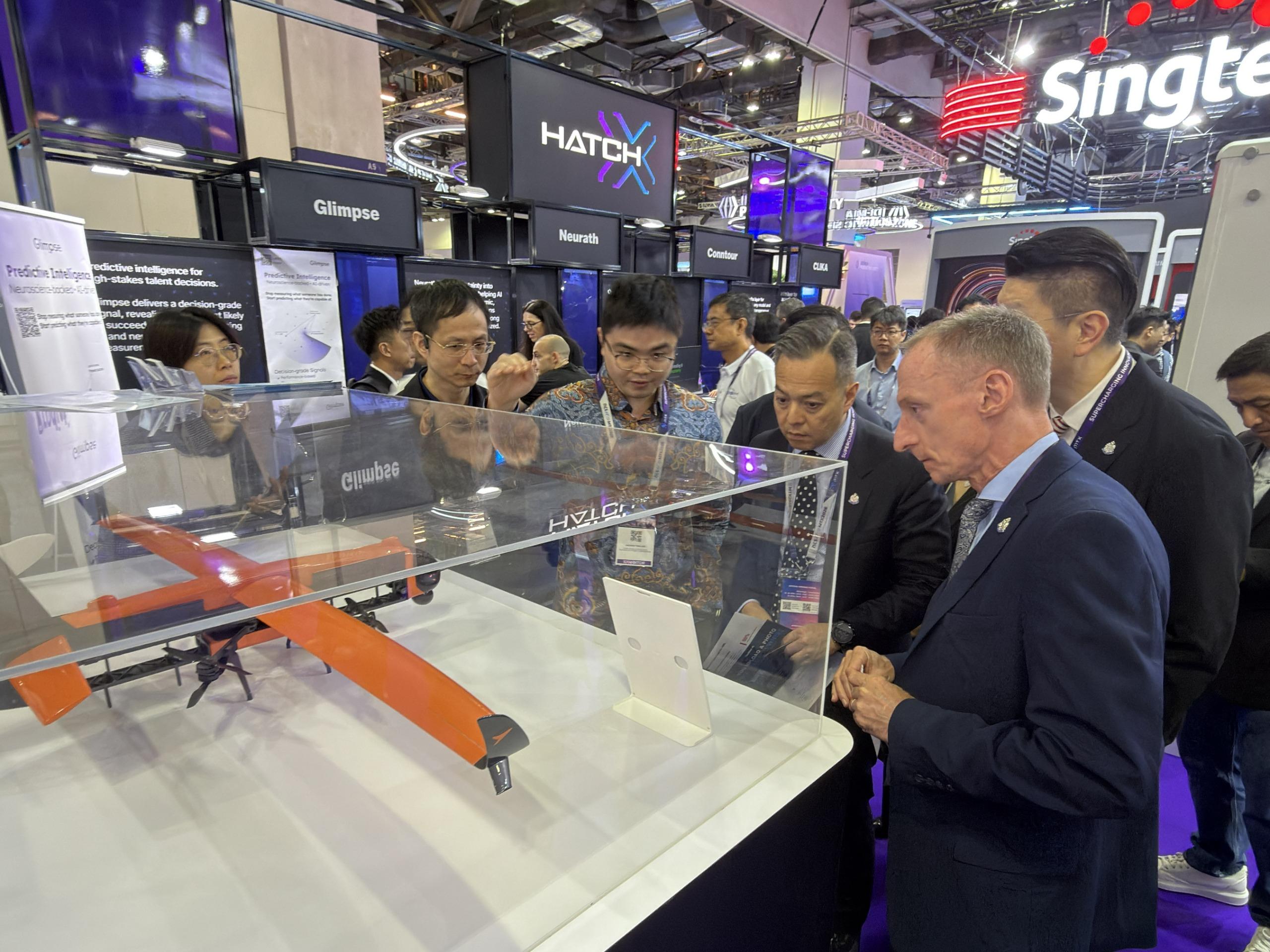 The Commissioner of Police, Mr Chow Yat-ming, led a delegation of the Hong Kong Police Force (HKPF) to Singapore, from April 27 to 29, to attend MTX (Milipol TechX Summit) 2026. Photo shows Mr Chow (fourth left) and the delegation touring exhibitions to learn about the latest innovations in public safety.