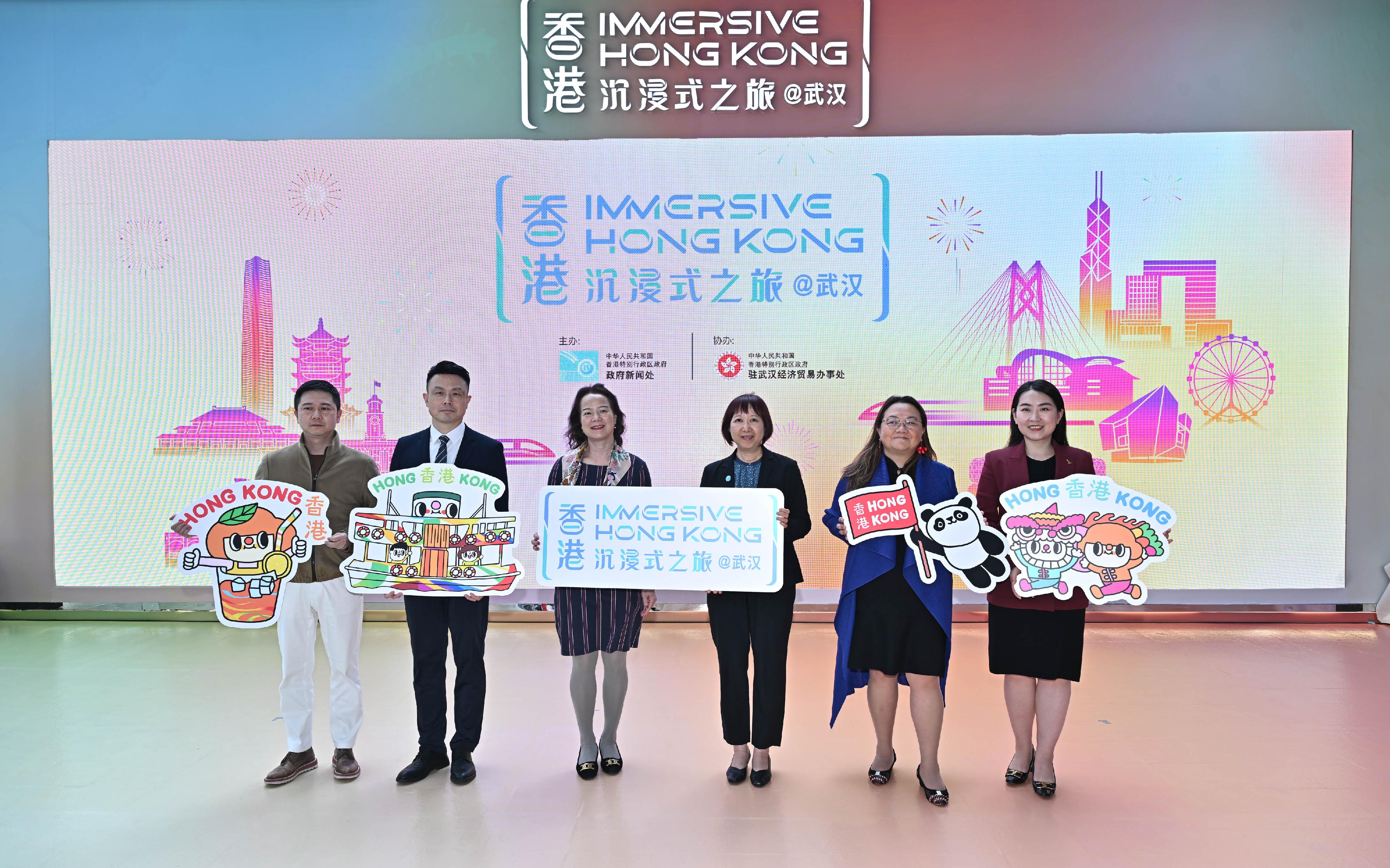 The "Immersive Hong Kong" roving exhibition, which showcases the diversity and latest developments of Hong Kong through interactive art technology, opened in Wuhan, Hubei Province, today (April 30). The exhibition invites visitors from Wuhan and across Hubei Province to explore the unique opportunities and potential for tourism, education, business and investment in Hong Kong. Photo shows (from left) the Assistant General Manager of the Shui On Xintiandi Wuhan Project, Mr Jeff Ao; the Deputy Director of the Hong Kong and Macao Affairs Office of the Wuhan Municipal People's Government, Mr Li Jun; the Director-General of the Hong Kong and Macao Affairs Office of the Hubei Provincial People's Government, Ms Zhang Xiaomei; Assistant Director of Information Services Miss Betty Chan; the Director of the Hong Kong Economic and Trade Office in Wuhan, Miss Alice Choi; and the Area Head-Northern China, Cathay Pacific, Ms Rose Wei, at the opening ceremony.