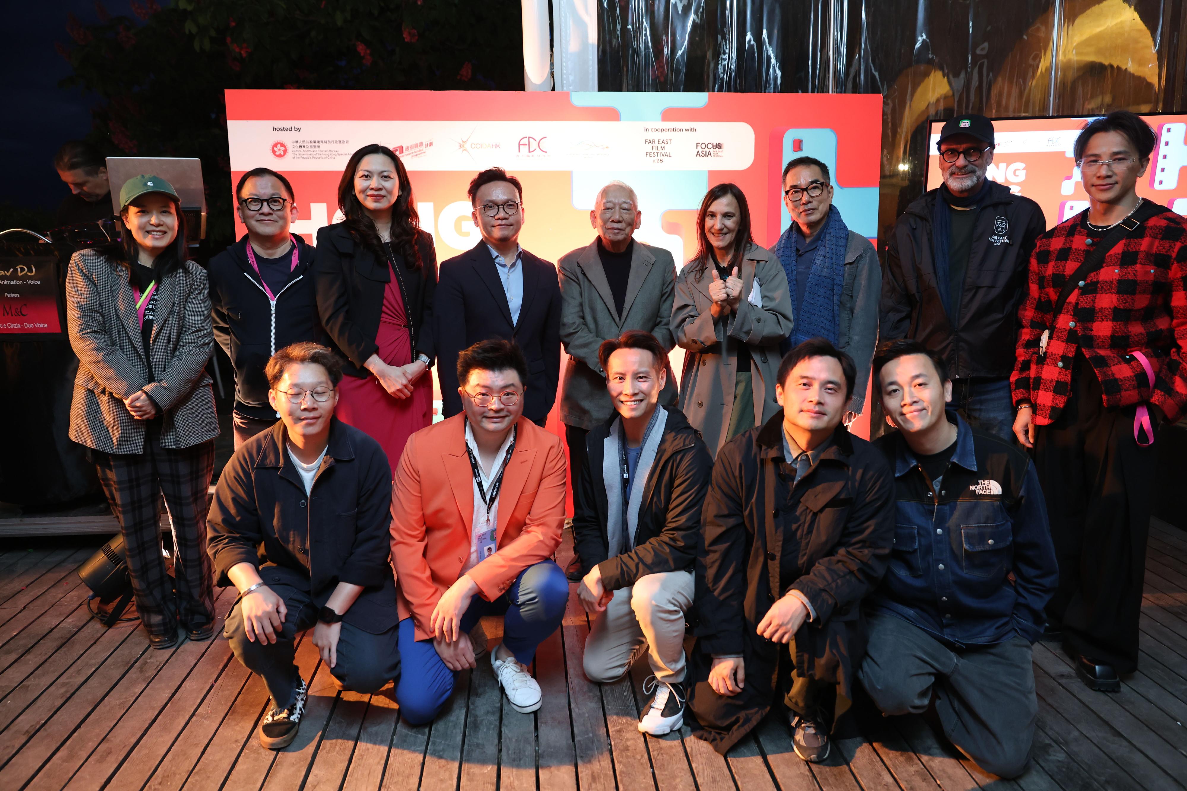 The Hong Kong Economic and Trade Office in Brussels (Brussels ETO) co-hosted the Hong Kong Night reception during the 28th Far East Film Festival. Photo shows the Deputy Representative of Brussels ETO, Miss Fiona Li (third left, back row); the Assistant Commissioner for Cultural and Creative Industries and Secretary-General of the Hong Kong Film Development Council, Mr Gary Mak (fourth left, back row); Hong Kong action choreographer and director, and the recipient of this year's Golden Mulberry Award for Lifetime Achievement, Mr Yuen Woo-ping (centre, back row); and the President of the Far East Film Festival in Udine, Italy, Ms Sabrina Baracetti (fourth right, back row), posing for a group photo with other Hong Kong film industry practitioners.