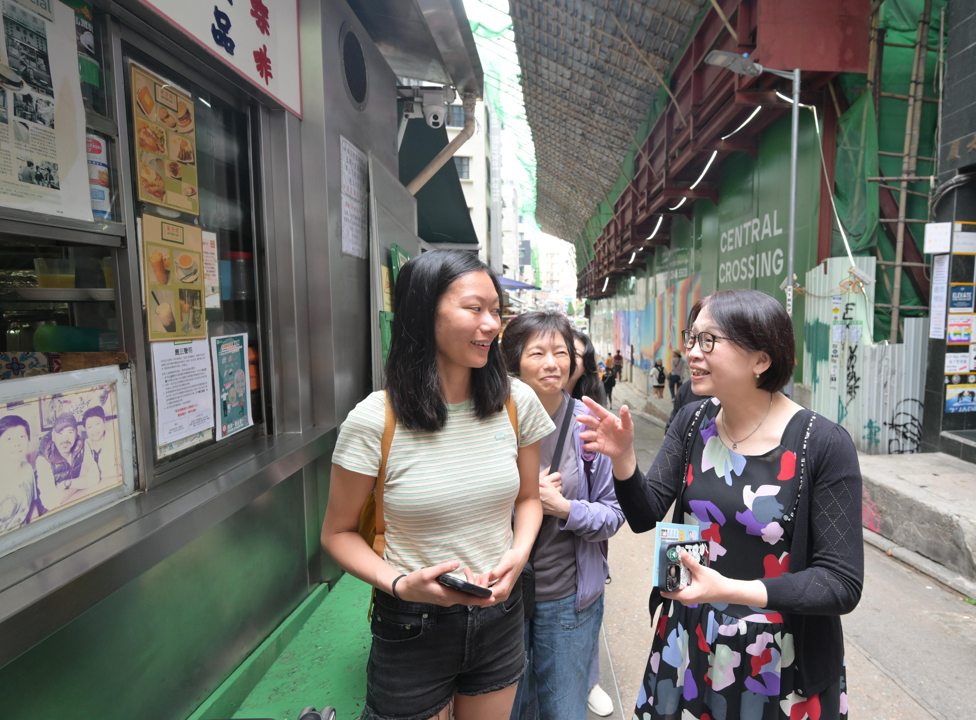 The Commissioner for Tourism, Mrs Angelina Cheung (right), today (May 2) visited the Old Town Central to observe crowd management and visitor activities of the tourist attraction during the 2026 Labour Day Golden Week of the Mainland.