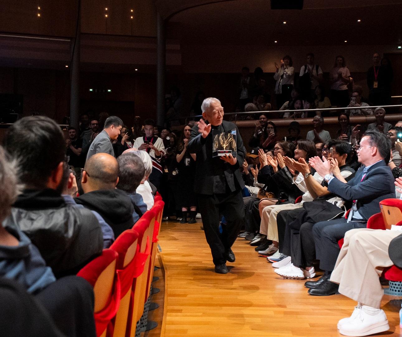 The Cultural and Creative Industries Development Agency (CCIDA) under the Culture, Sports and Tourism Bureau, and the Hong Kong Film Development Council (FDC) led an industry delegation to participate in the 28th Far East Film Festival (FEFF) in Udine, Italy, held from April 24 to May 2 (Udine time). Photo shows veteran Hong Kong director and acclaimed action choreographer Yuen Woo-ping (centre), receiving the Golden Mulberry Award for Lifetime Achievement at the closing ceremony of the FEFF in the evening on May 2 (Udine time). Assistant Commissioner for Cultural and Creative Industries and the Secretary-General of the FDC, Mr Gary Mak (first right), also attended and extended congratulations.