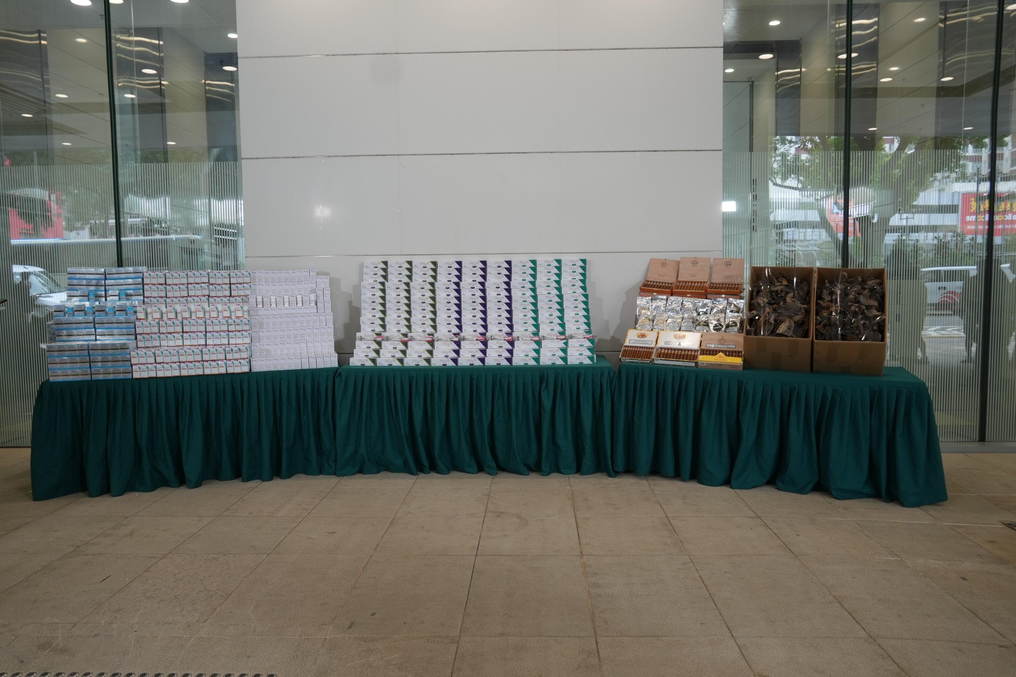 Hong Kong Customs detected two suspected smuggling cases involving river trade vessels on April 20 and 21 respectively. Large batches of suspected smuggled goods with a total estimated market value of about $41 million were seized. Photo shows the suspected smuggled goods seized.