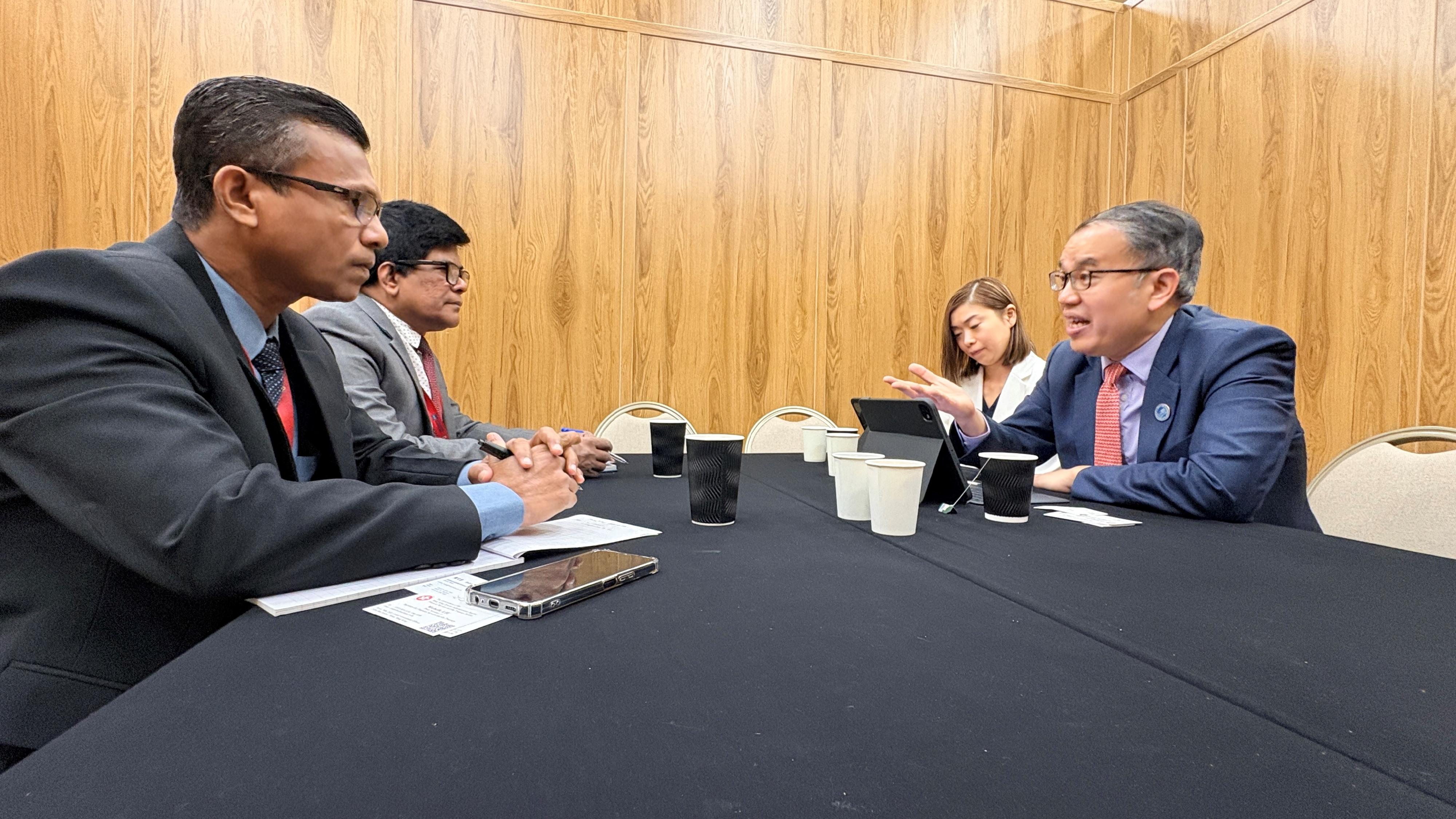 The Secretary for Financial Services and the Treasury, Mr Christopher Hui, attended the 59th Annual Meeting of the Board of Governors of the Asian Development Bank held in Samarkand, Uzbekistan, on May 5 (Samarkand time). Photo shows Mr Hui (first right) meeting with the Deputy Secretary to the Treasury, Ministry of Finance, Planning and Economic Development of Sri Lanka, Mr Anura Hapugala (second left), on the sidelines to encourage them to commence negotiations on a Comprehensive Avoidance of Double Taxation Agreement with Hong Kong.
