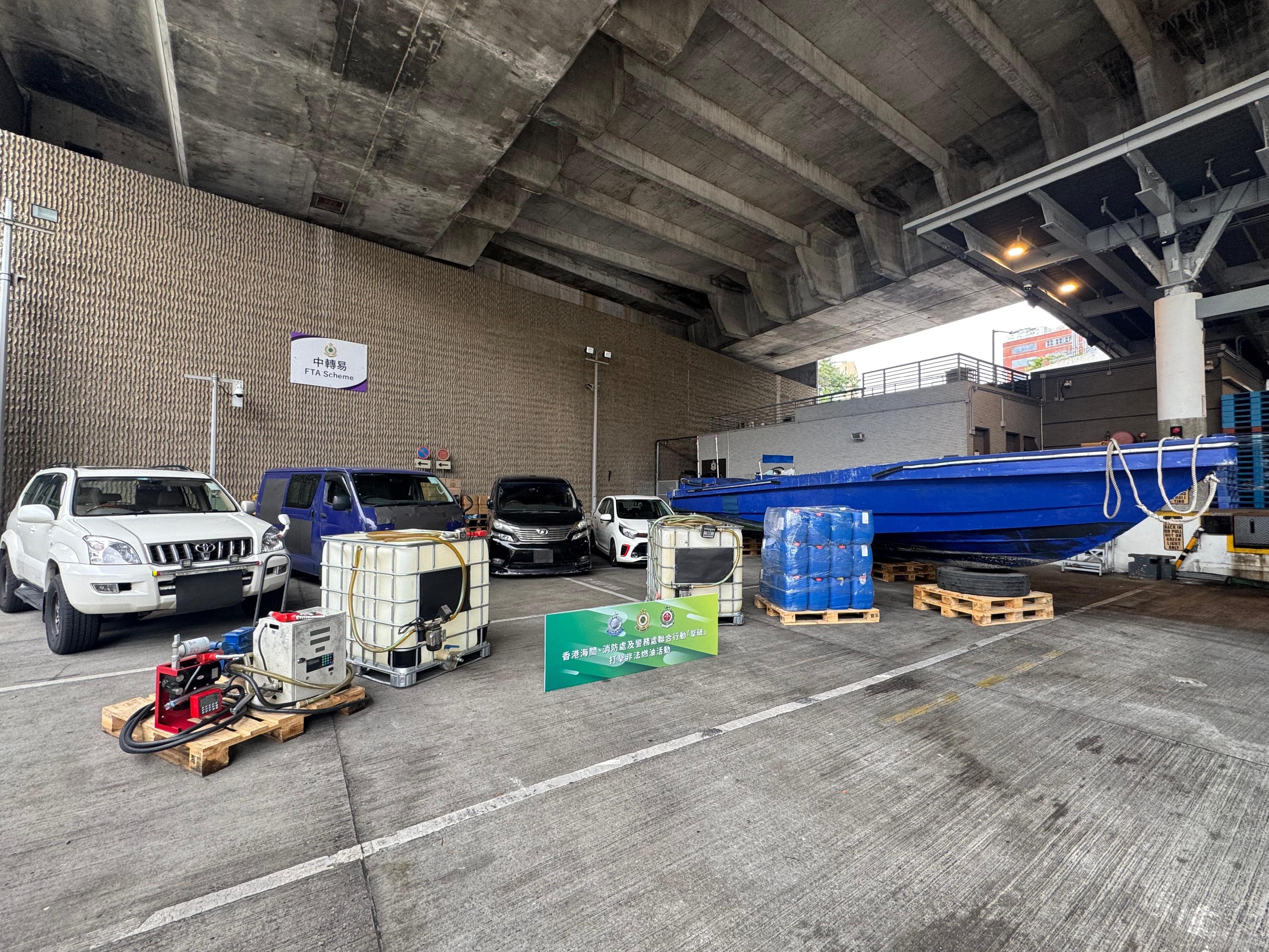 Hong Kong Customs, the Fire Services Department and the Hong Kong Police Force mounted a territory-wide joint operation codenamed "Knockout" targeting illicit fuel activities from April 13 to 20, aiming to cut off the supply of illicit fuel and tackle illegal fuelling activities in downtown areas. Photo shows the vehicles, speedboat and refuelling tools seized in the joint operation. 