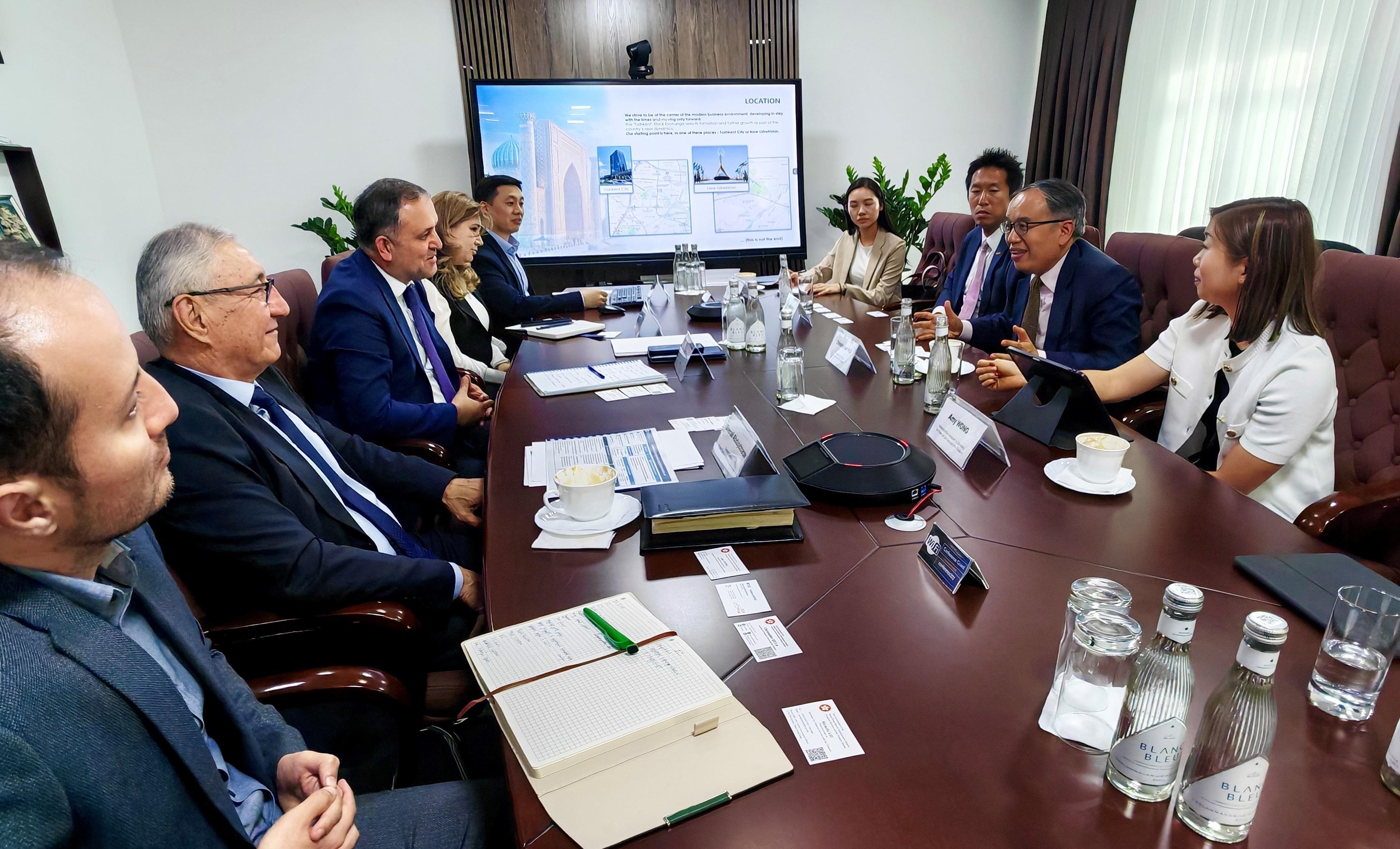 The Secretary for Financial Services and the Treasury, Mr Christopher Hui, called on the Tashkent Stock Exchange on May 6 (Tashkent time) in Tashkent, the capital of Uzbekistan. Photo shows Mr Hui (second right) meeting with its Chief Executive Officer, Mr Fayzulla Tashov (third left), and encouraging Uzbek enterprises to leverage Hong Kong's role as a major capital formation centre for equity and bond financing. Also present is the Hong Kong Economic and Trade Office in Berlin, Mr Indiana Wong (third right).
