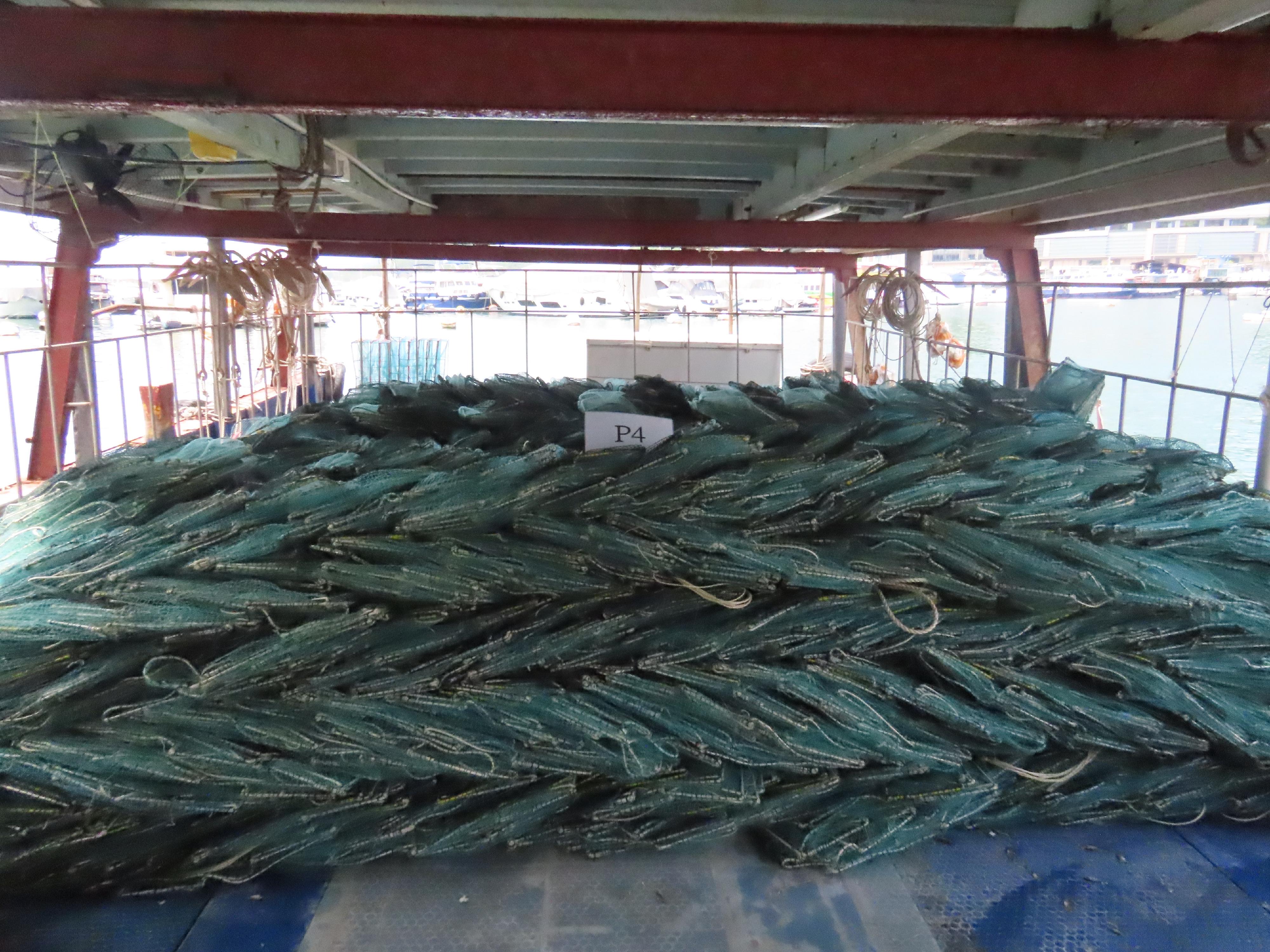 The Agriculture, Fisheries and Conservation Department today (May 12) laid charges against a local coxswain and five Mainland fishermen deckhands suspected of engaging in fishing using snake cages on a local vessel in waters off Po Toi. Photo shows some of the snake cages seized.