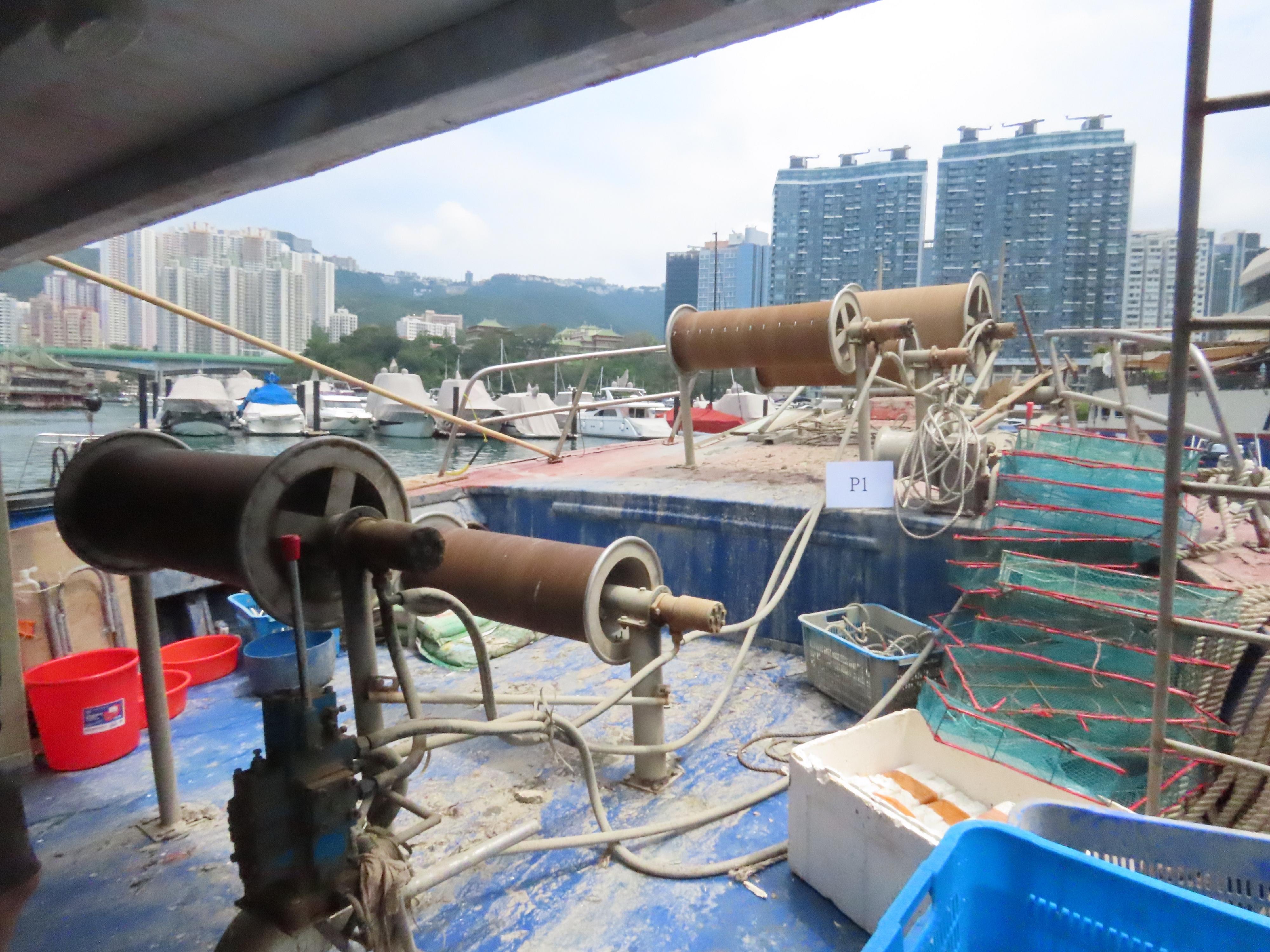 The Agriculture, Fisheries and Conservation Department today (May 12) laid charges against a local coxswain and five Mainland fishermen deckhands suspected of engaging in fishing using snake cages on a local vessel in waters off Po Toi. Photo shows some of the winches seized.