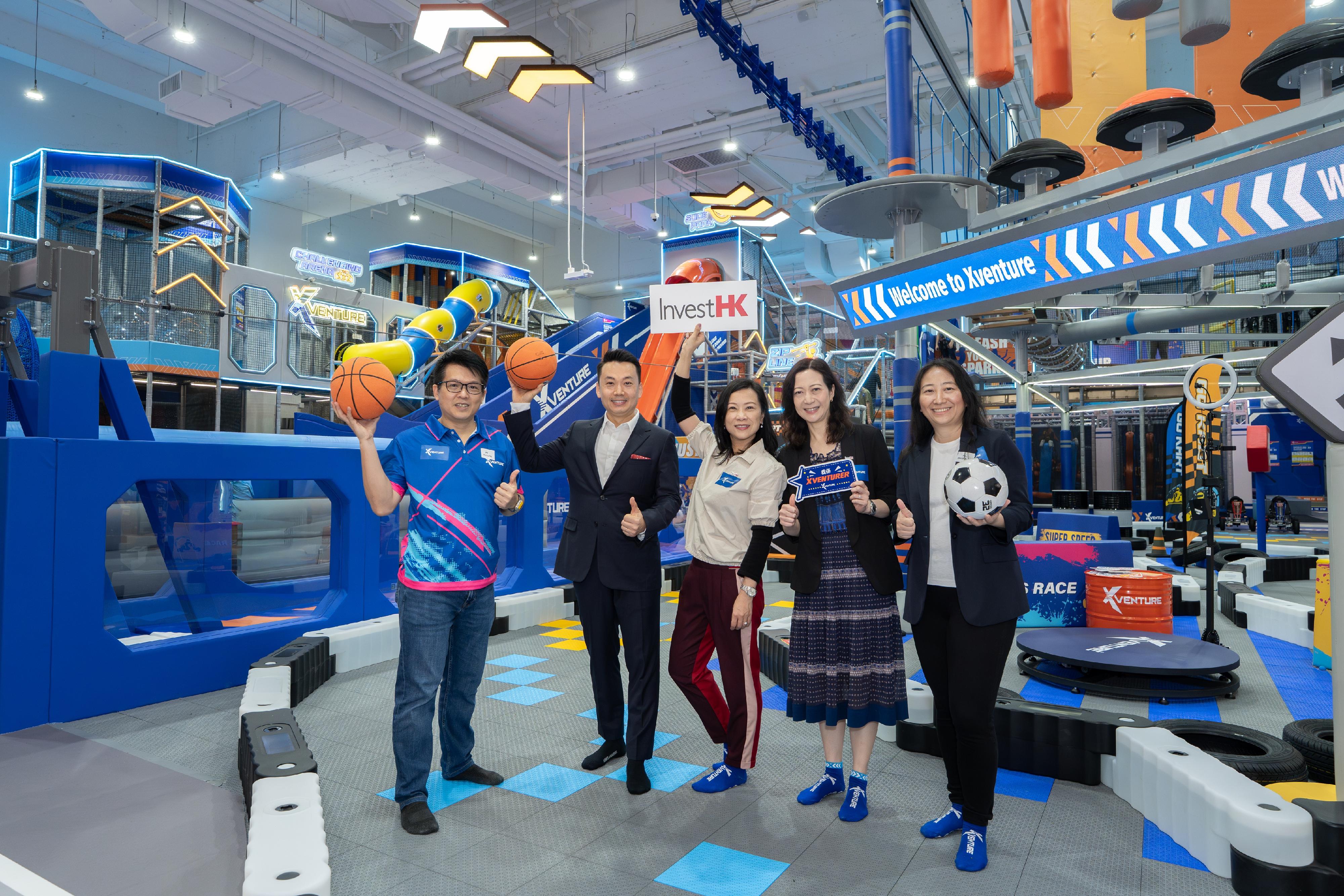 Invest Hong Kong (InvestHK) today (May 15) welcomed the opening of Xventure, a new indoor active sports park in Hong Kong. Photo shows the Head of Consumer and Hospitality of InvestHK, Ms Sindy Wong (centre); the General Manager of Kiztopia Hong Kong, Mr Ricky Ng (first left); the Founder and Chief Executive Officer of Kiztopia, Ms Heidi Tian (first right); the Chief Development Officer and Co-founder of Kiztopia, Mr Tony Ma (second left) and the Senior Vice President, Consumer and Hospitality of InvestHK, Ms Jenny Hui (second right), at the new store.