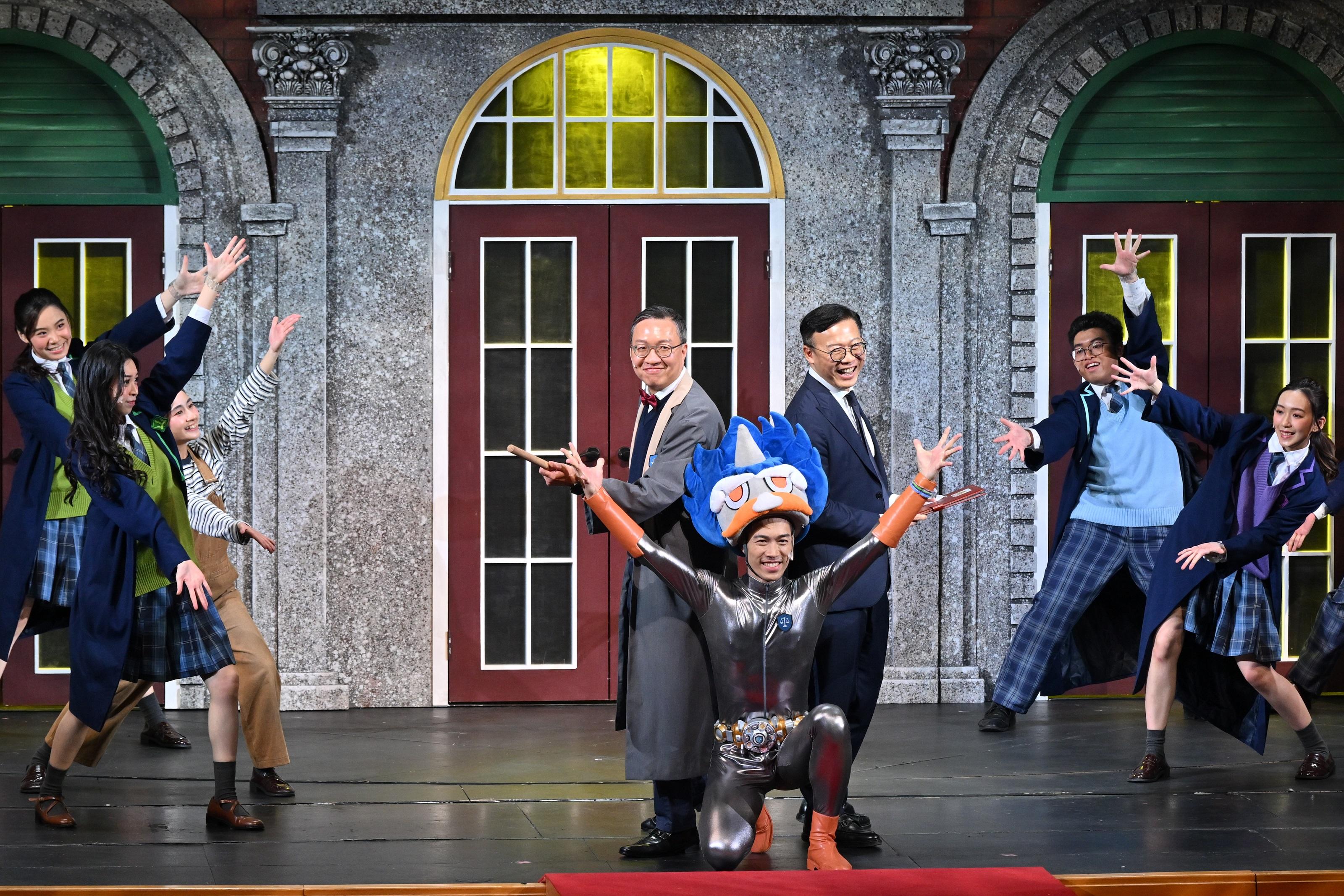 The Department of Justice held a large-scale Rule of Law Drama Day today (May 16) at the Grand Theatre of the Hong Kong Cultural Centre, presenting the drama "Rule of Law Academy - Adventure to the Stars". Photo shows the Secretary for Justice, Mr Paul Lam, SC (second row, left), and the Deputy Secretary for Justice, Dr Cheung Kwok-kwan (second row, right), performing onstage.