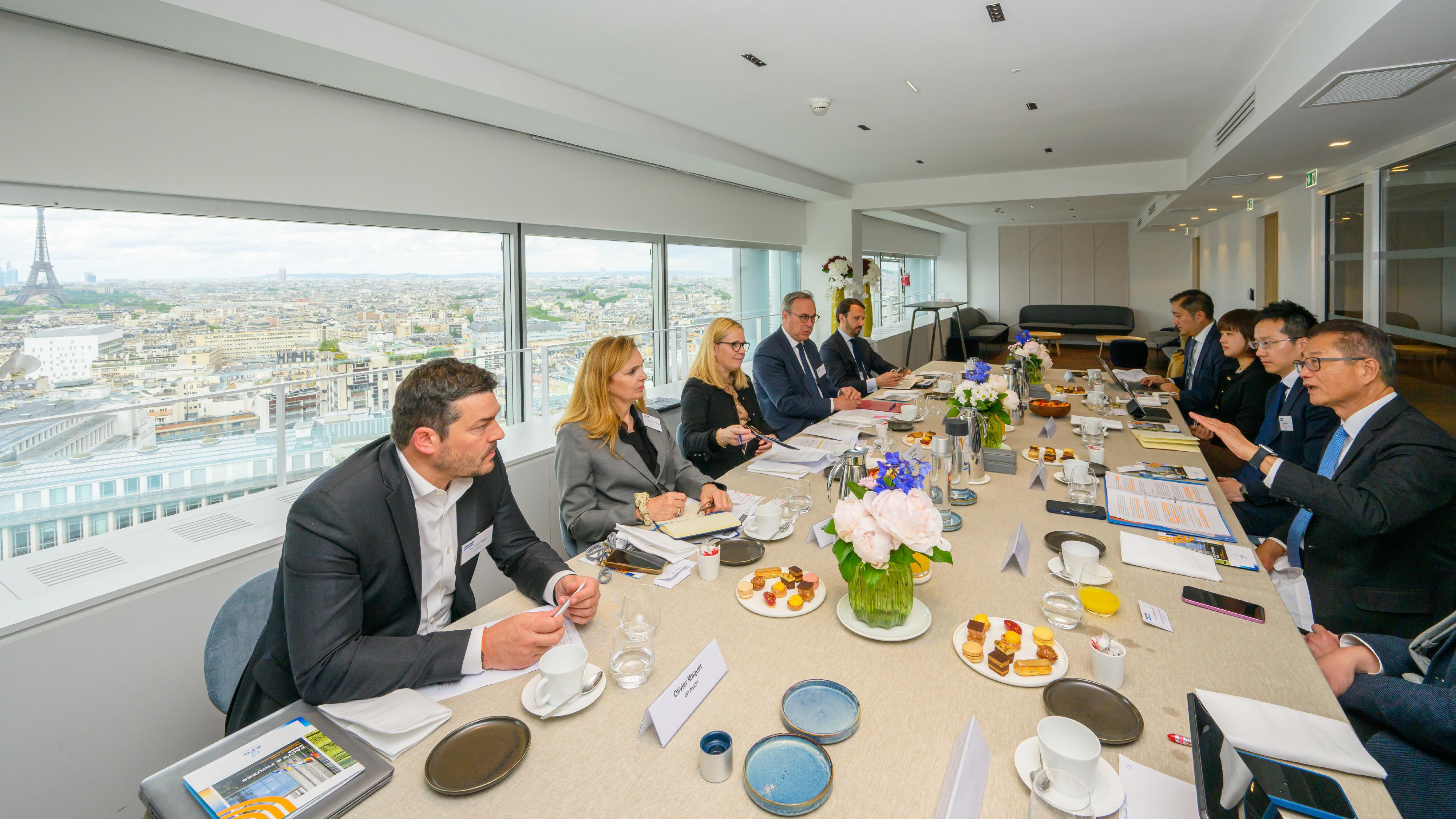 The Financial Secretary, Mr Paul Chan (first right), met with key members of the French Asset Management Association in Paris, France, on May 18 (Paris time).