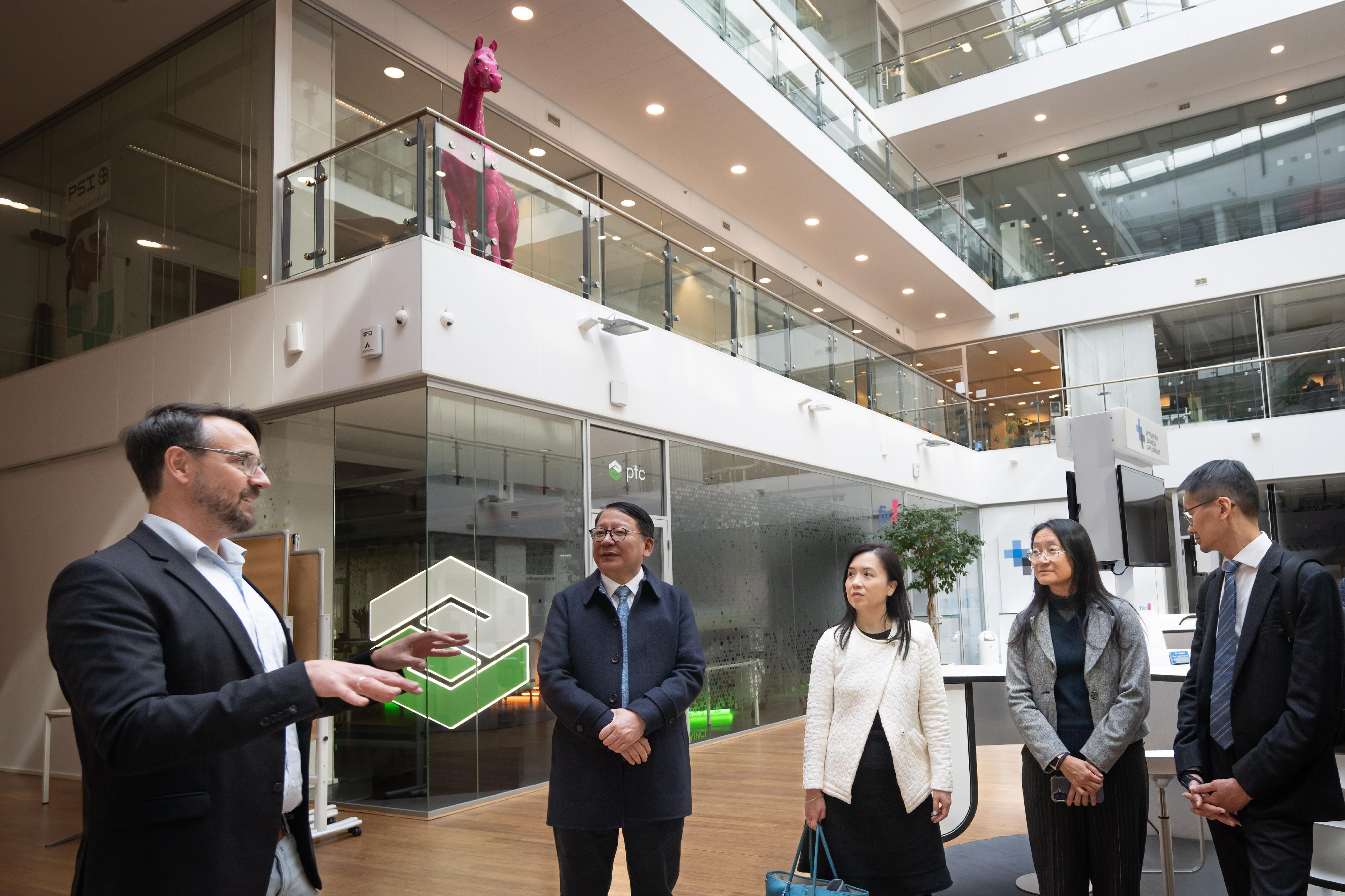 The Chief Secretary for Administration, Mr Chan Kwok-ki, led a delegation of the Working Group on Planning and Construction of the University Town under the Committee on Development of the Northern Metropolis to commence a visit to Germany yesterday (May 18, Aachen time). Photo shows Mr Chan (second left), and the delegation visiting RWTH Aachen University, and touring its demonstration factory.