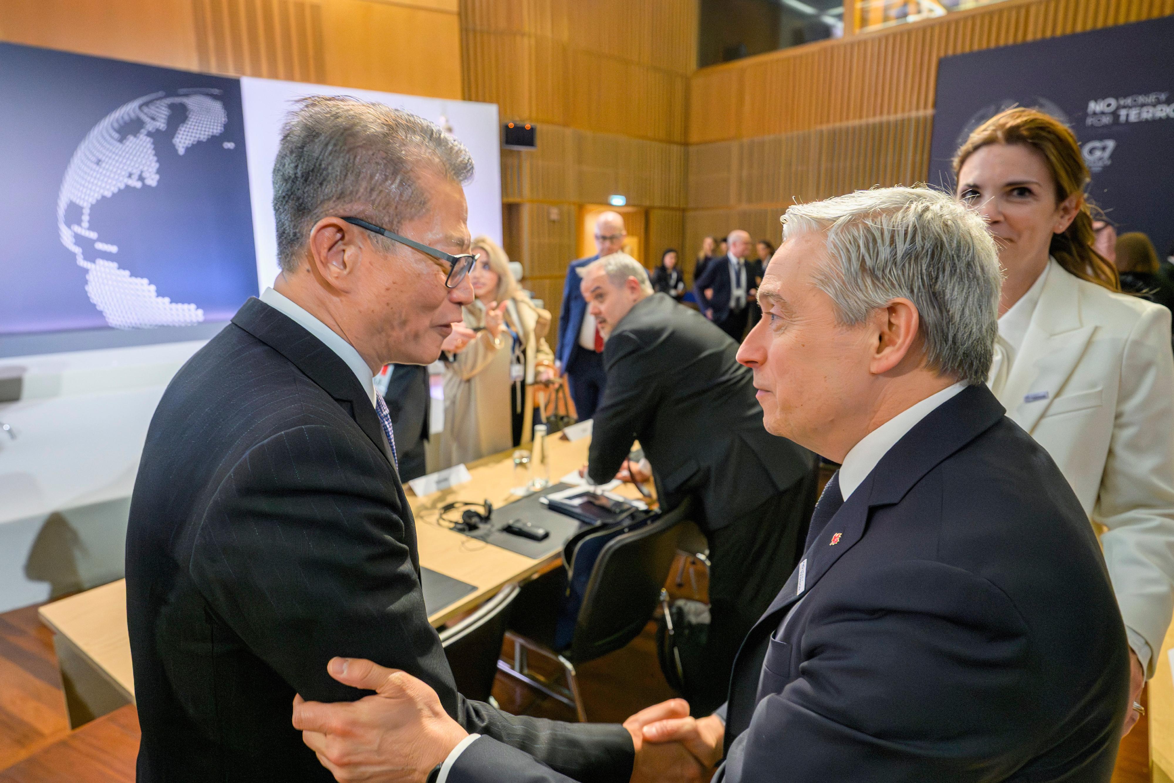 The Financial Secretary, Mr Paul Chan, attended the "No Money for Terror" Ministerial Conference on Counter-Terrorism Financing in Paris, France, on May 19 (Paris time). Photo shows Mr Chan (left) in conversation with the Canadian Minister of Finance and National Revenue, Mr François-Philippe Champagne (right), who also attended the conference.