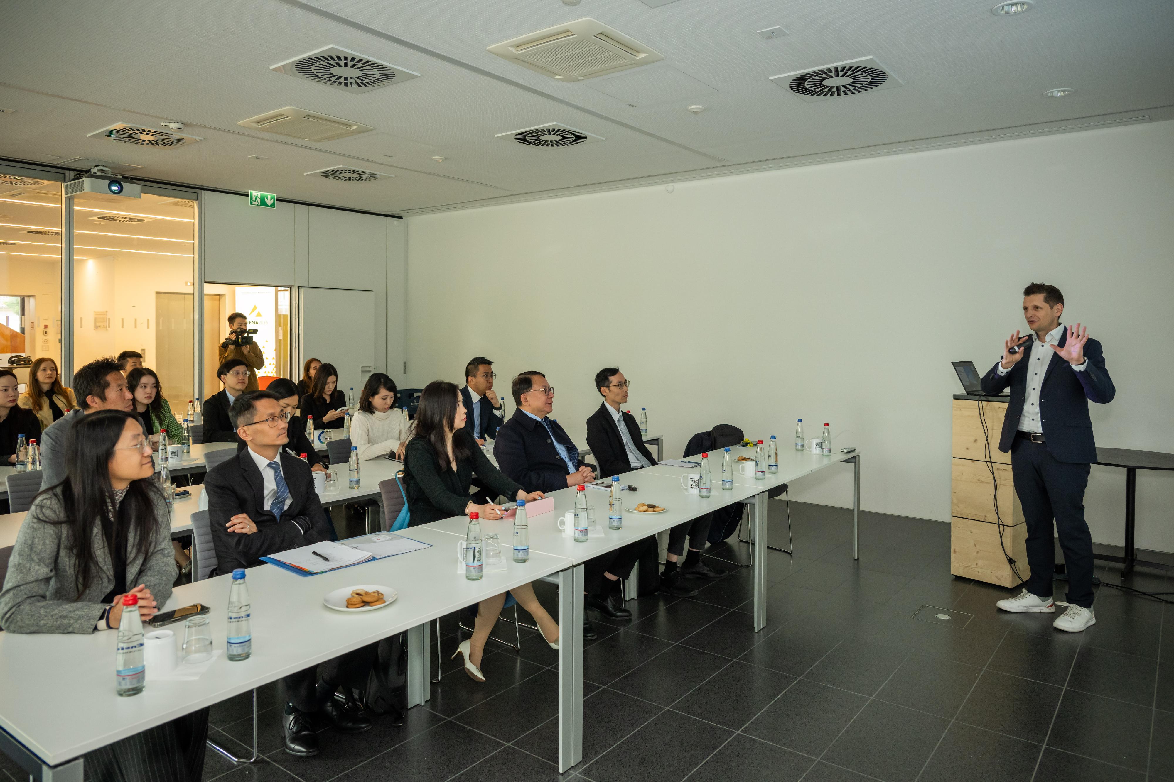 The Chief Secretary for Administration, Mr Chan Kwok-ki, led the delegation of the Working Group on Planning and Construction of the University Town under the Committee on Development of the Northern Metropolis to continue its trip to Germany yesterday (May 19, Stuttgart time). Photo shows Mr Chan (third right), and the delegation visiting the ARENA2036 research campus for automobiles on the campus of the University of Stuttgart, and meeting with university representatives.
