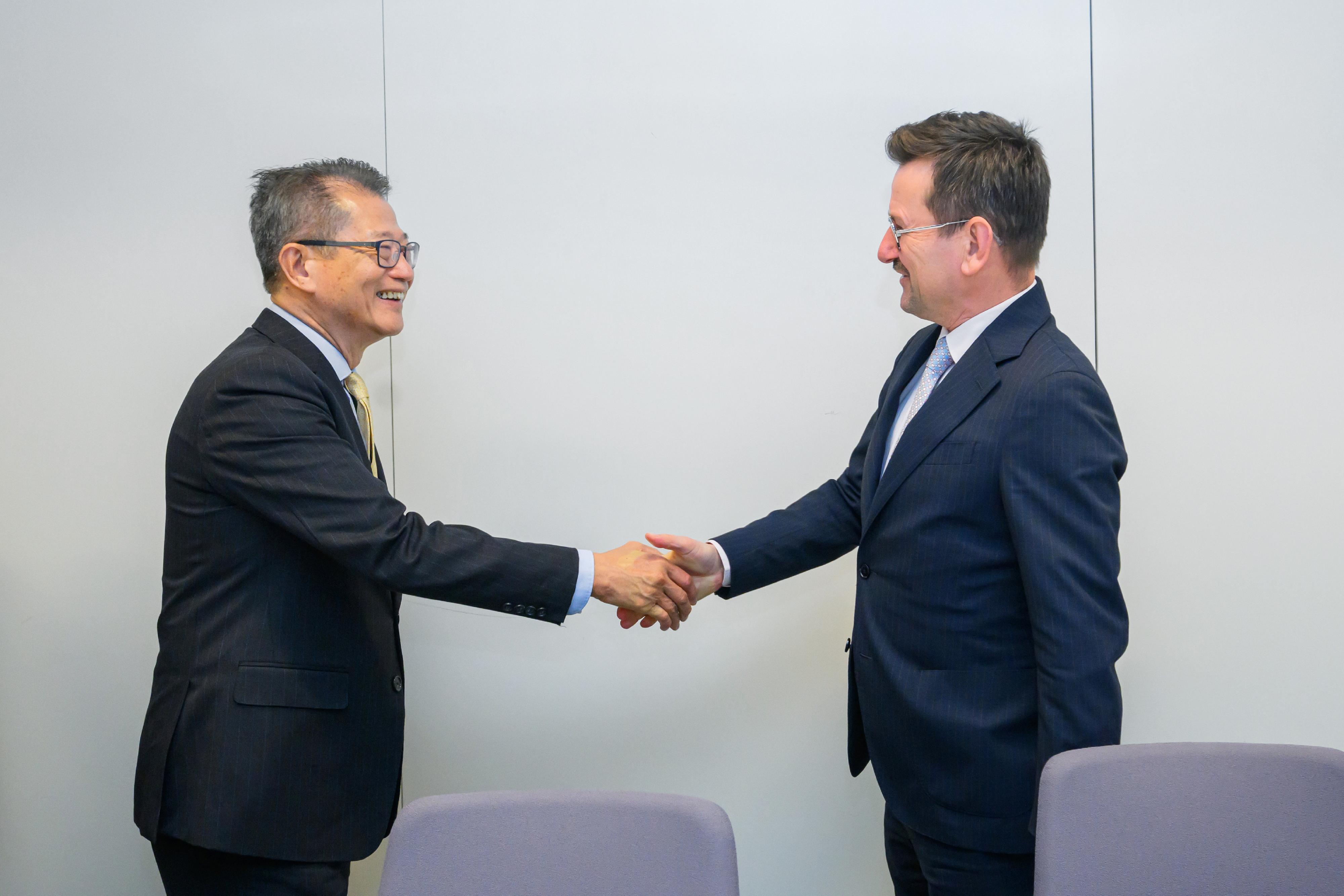The Financial Secretary, Mr Paul Chan (left), met with the Managing Director of the Department for Asia and the Pacific of the European External Action Service, Mr Erik Kurzweil (right), in Brussels, Belgium, on May 20 (Brussels time).