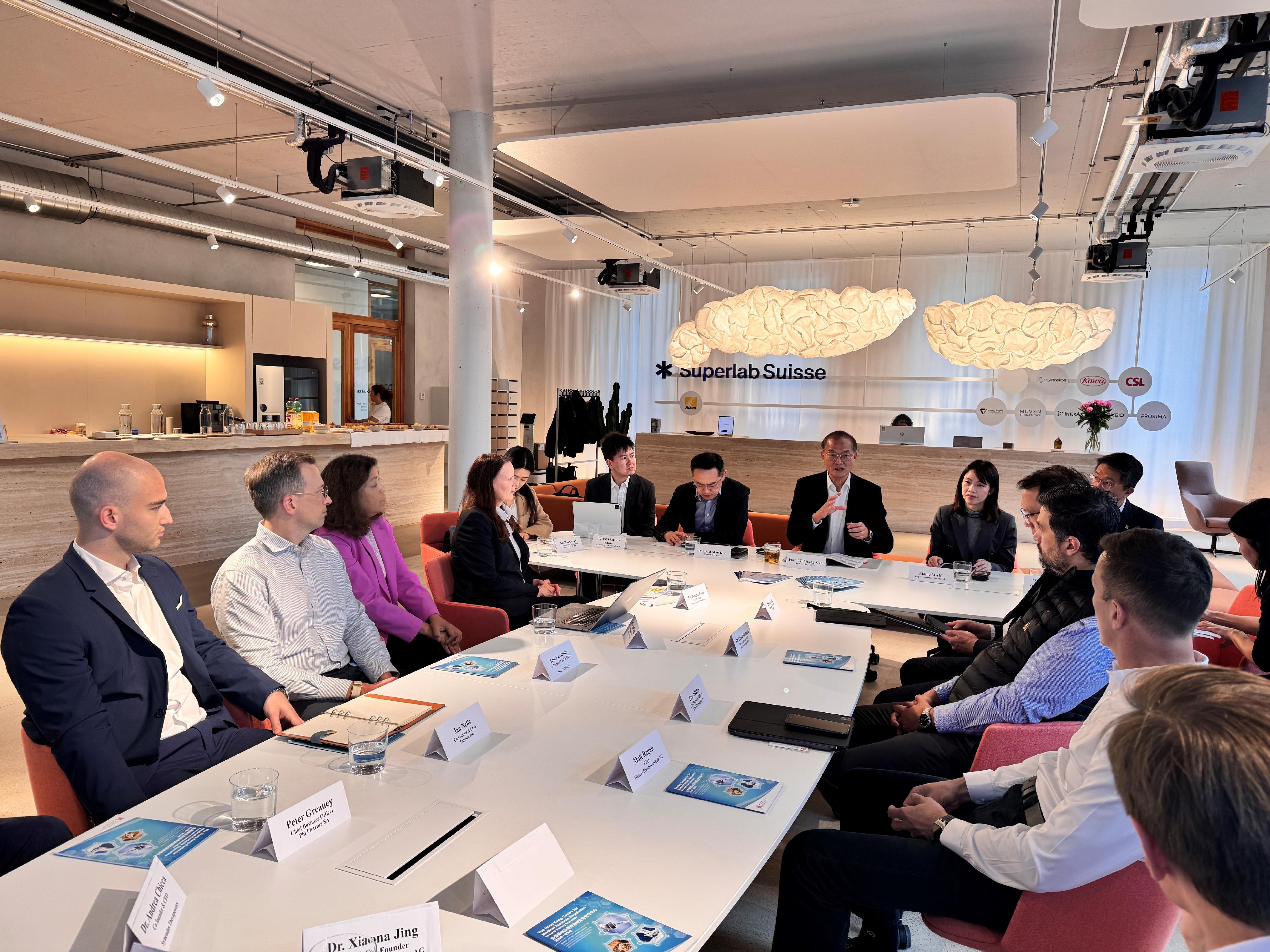 The Secretary for Health, Professor Lo Chung-mau (seventh right), held a roundtable meeting with a number of multinational pharmaceutical and healthcare companies in Zurich, Switzerland, yesterday (May 20, Zurich time) to highlight the measures put forward by the Hong Kong Special Administrative Region Government to develop Hong Kong into an international health and medical innovation hub. The Director of Health, Dr Ronald Lam (seventh left); the Controller of the Centre for Health Protection of the Department of Health, Dr Edwin Tsui (sixth left); and Deputy Secretary for Health Ms Elaine Mak (sixth right) also attended.