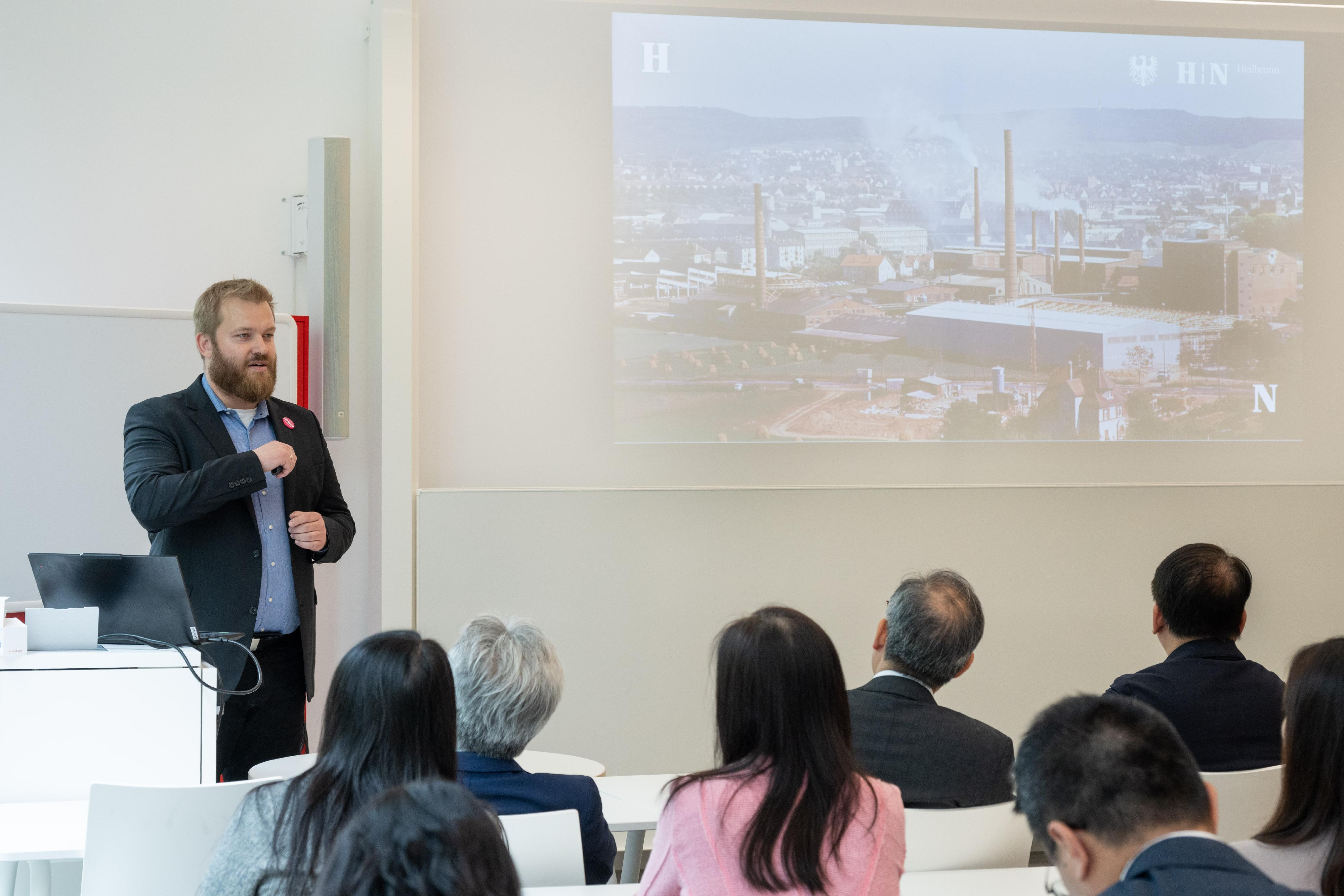 The delegation of the Working Group on Planning and Construction of the University Town under the Committee on Development of the Northern Metropolis led by the Chief Secretary for Administration, Mr Chan Kwok-ki, yesterday (May 20, Heilbronn time) continued its visit to Germany. Photo shows Mr Chan (first right) and the delegation visiting Bildungscampus Heilbronn and interacting with a representative from the government of Heilbronn City.