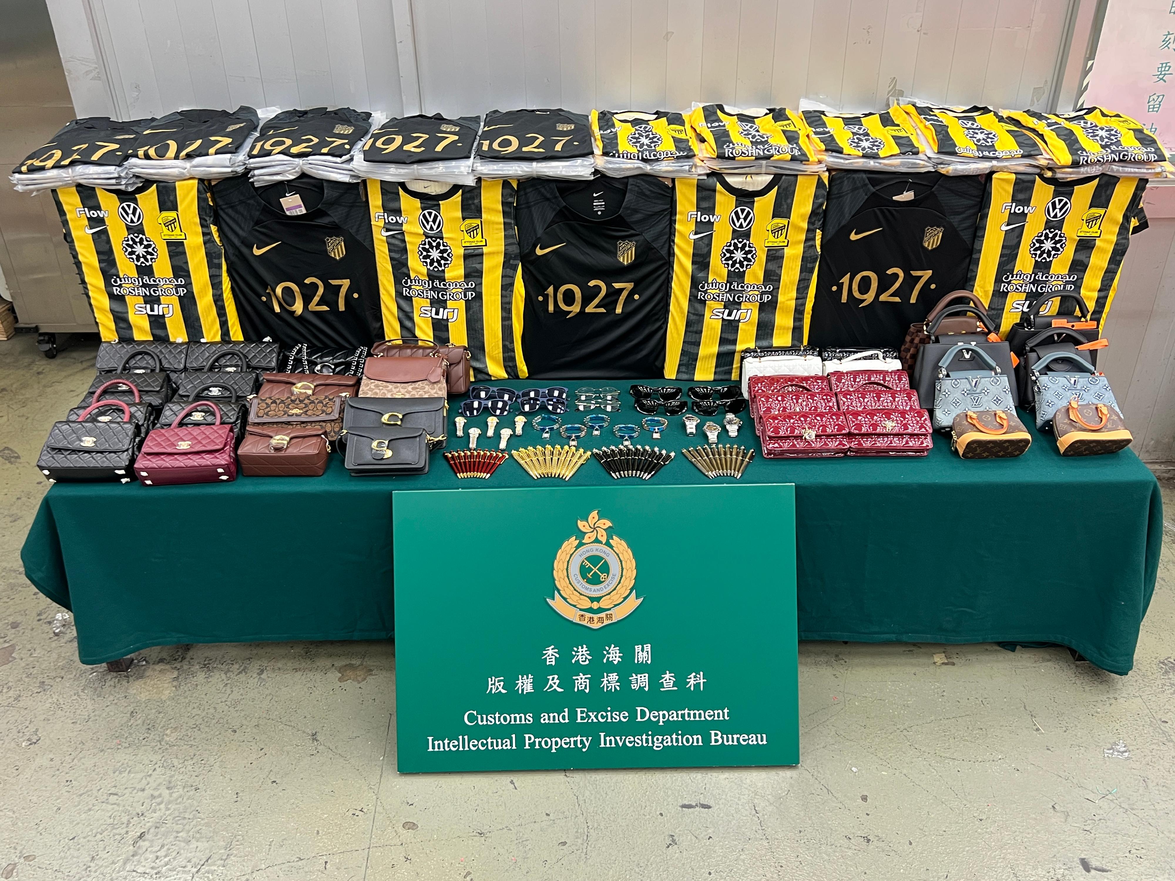 Hong Kong Customs on April 27 seized about 5 000 suspected counterfeit goods with an estimated market value of about $2.6 million at Hong Kong International Airport. Photo shows the suspected counterfeit goods seized, including pens, jerseys, handbags, glasses and watches.